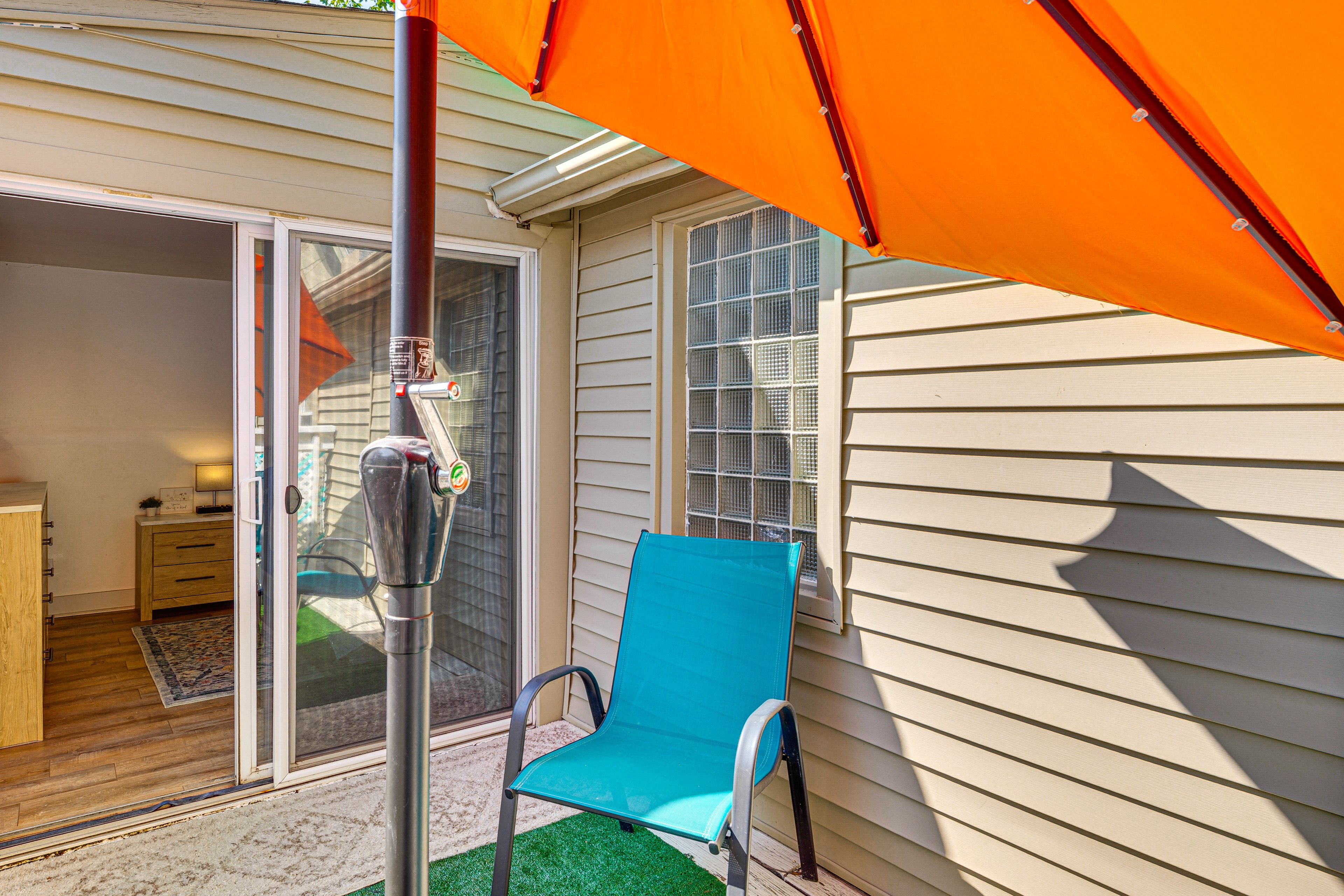 House Exterior | Furnished Balcony w/ Umbrella