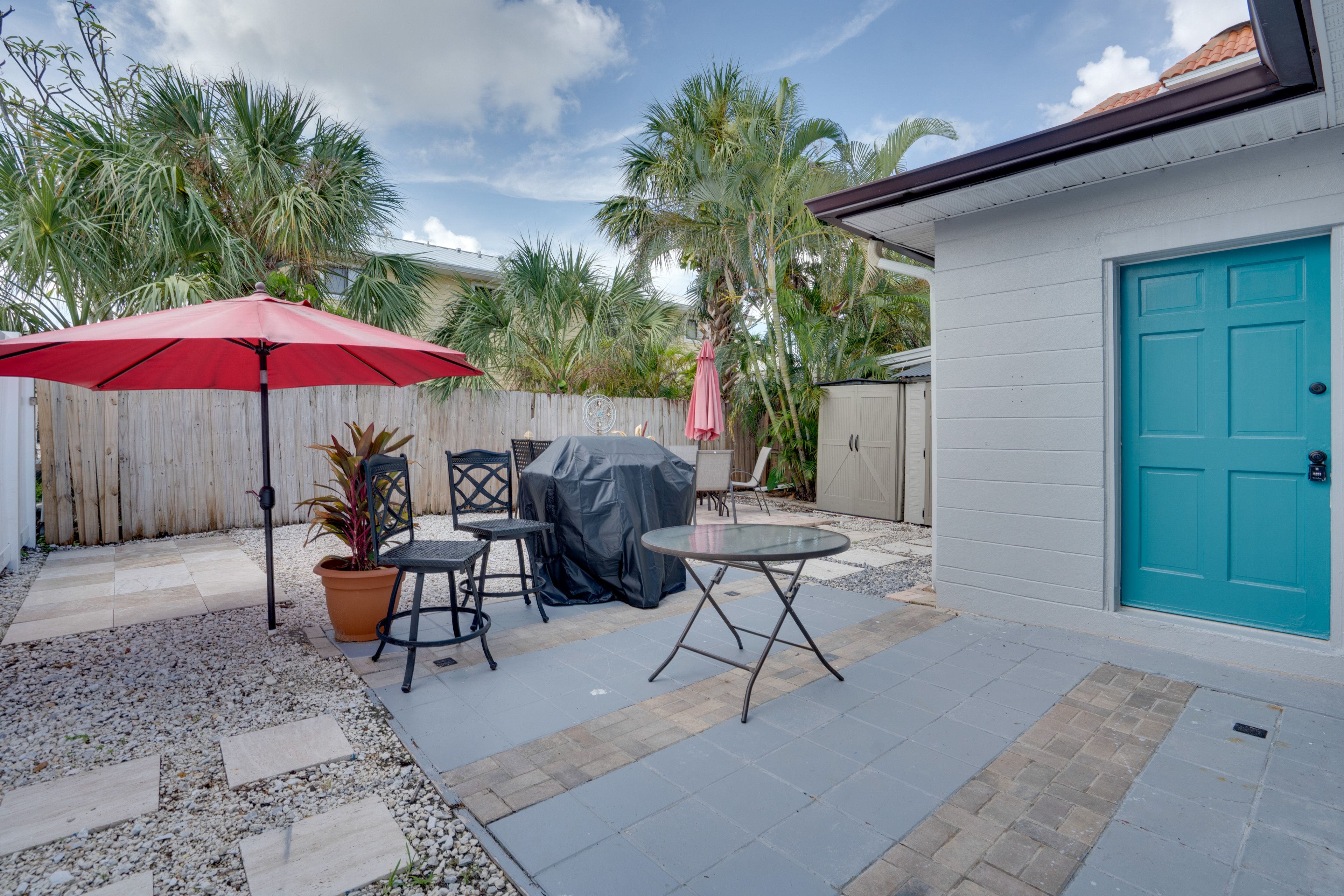 House Exterior | Furnished Patio | 2 Umbrellas | Dining Area | Gas Grill