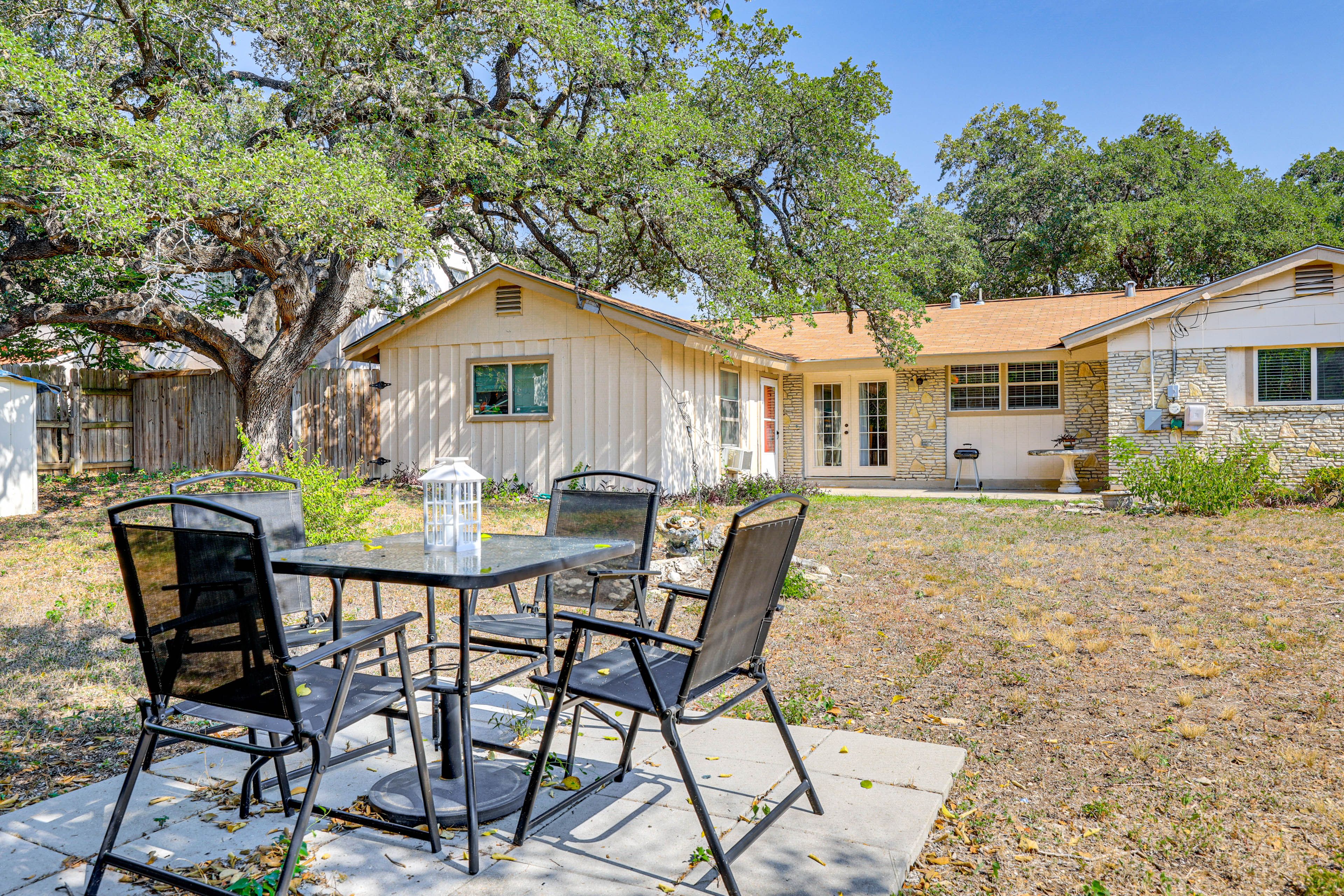 Fenced Backyard | Outdoor Dining Area | Charcoal Grill