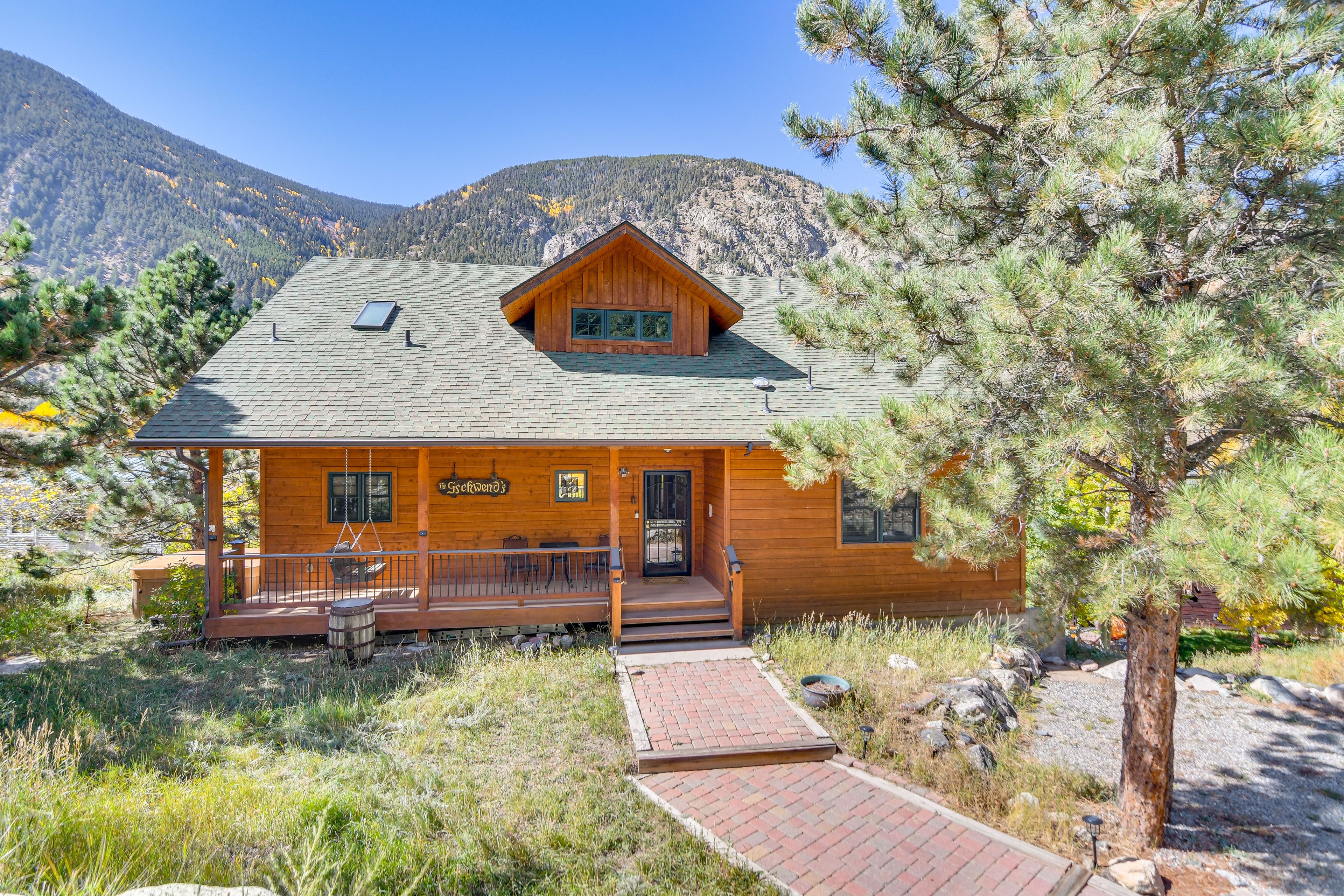 Cabin Exterior | Covered Porch w/ Seating | Mountain Views