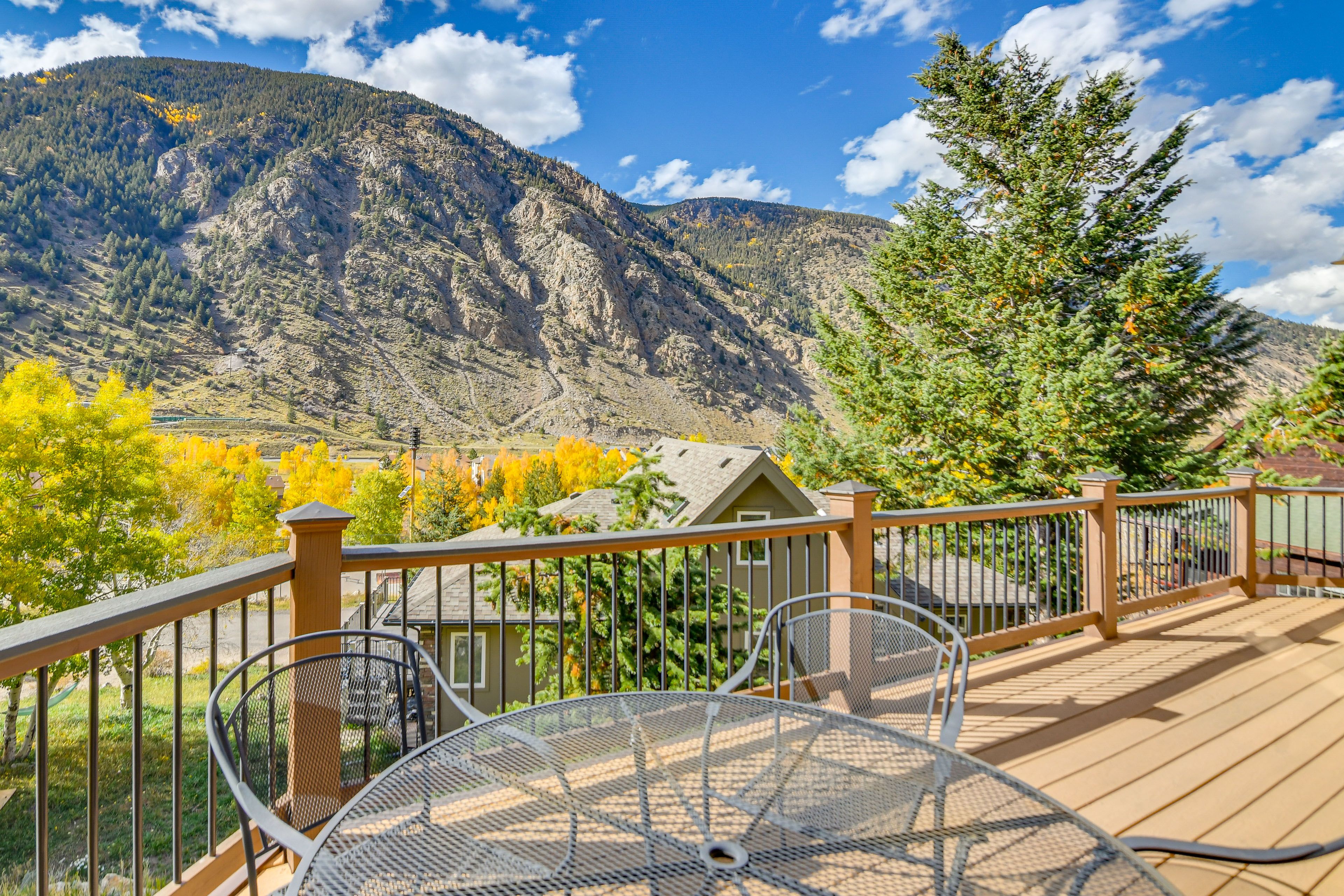 Cabin Exterior | Deck w/ Dining Area | Mountain Views