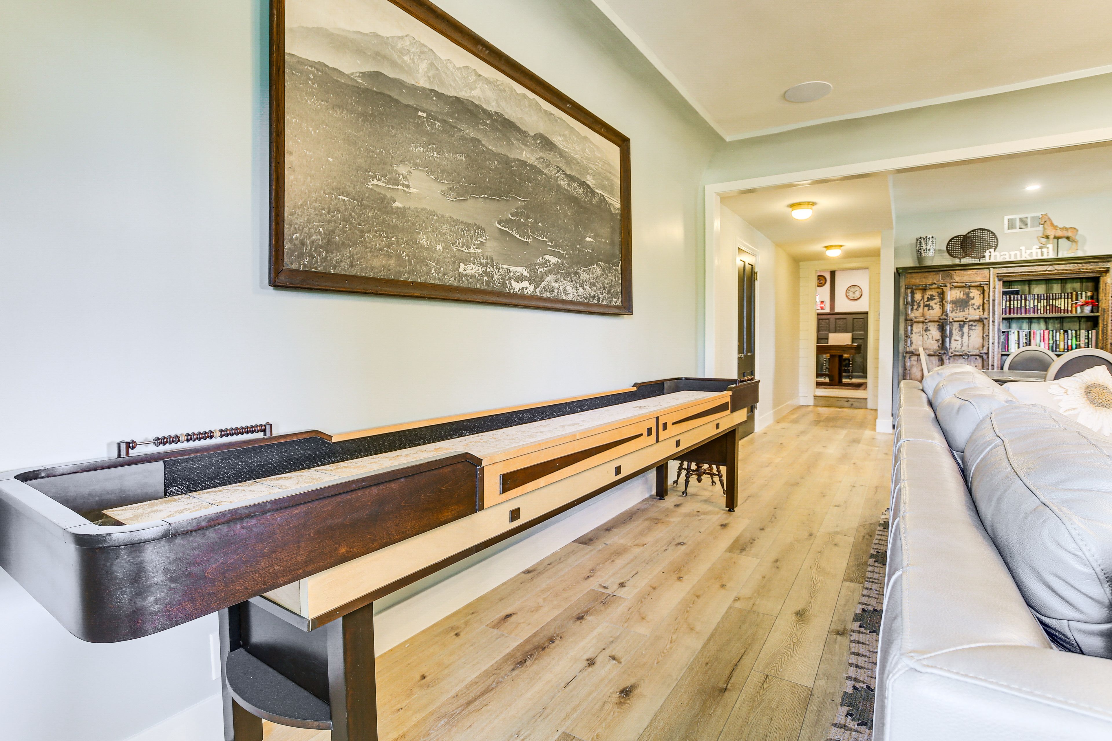 Den | Shuffleboard | Skee-Ball | Fireplace | Basement