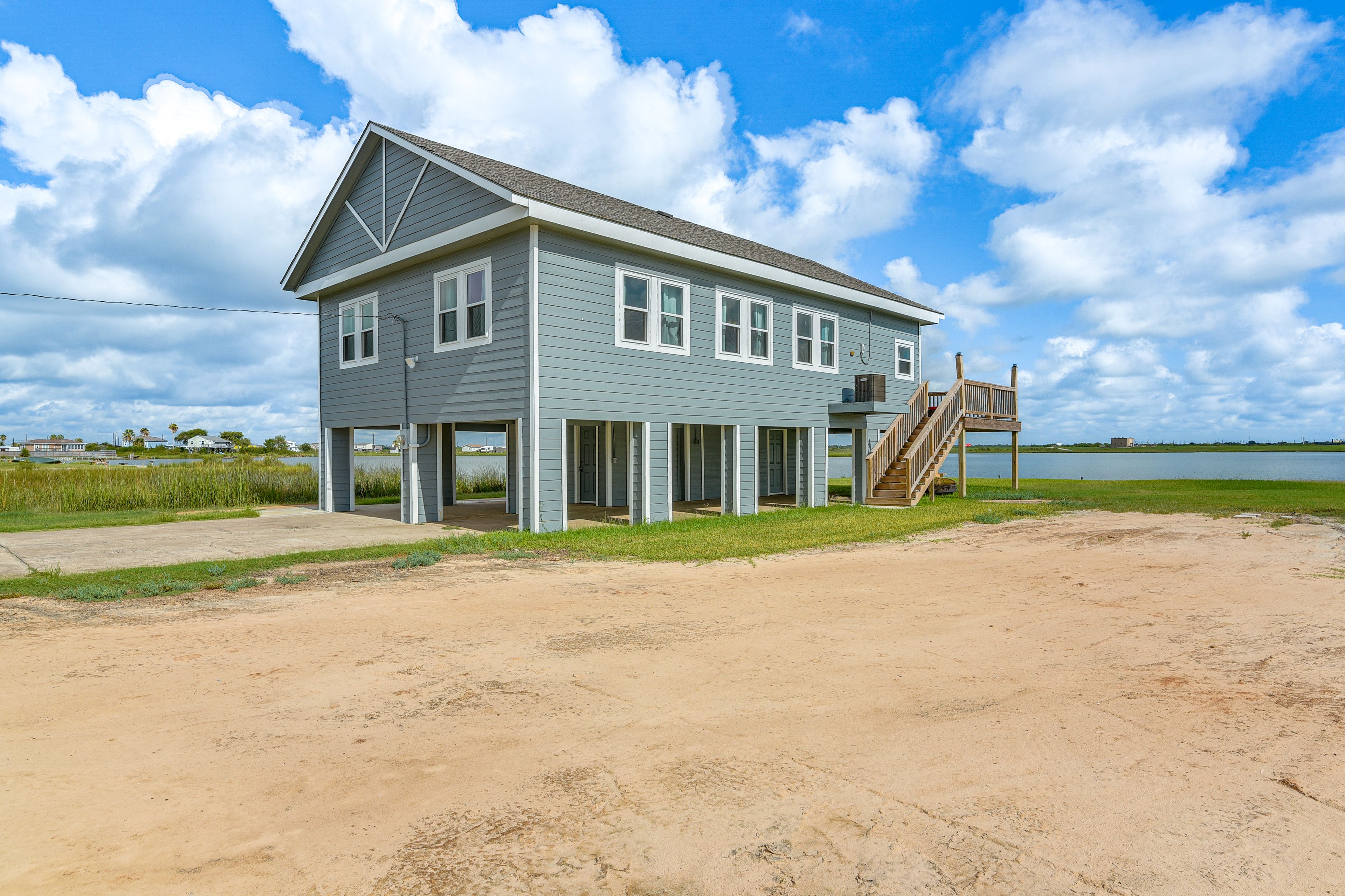House Exterior | Lagoon On-Site | Fire Pit | Dining Areas