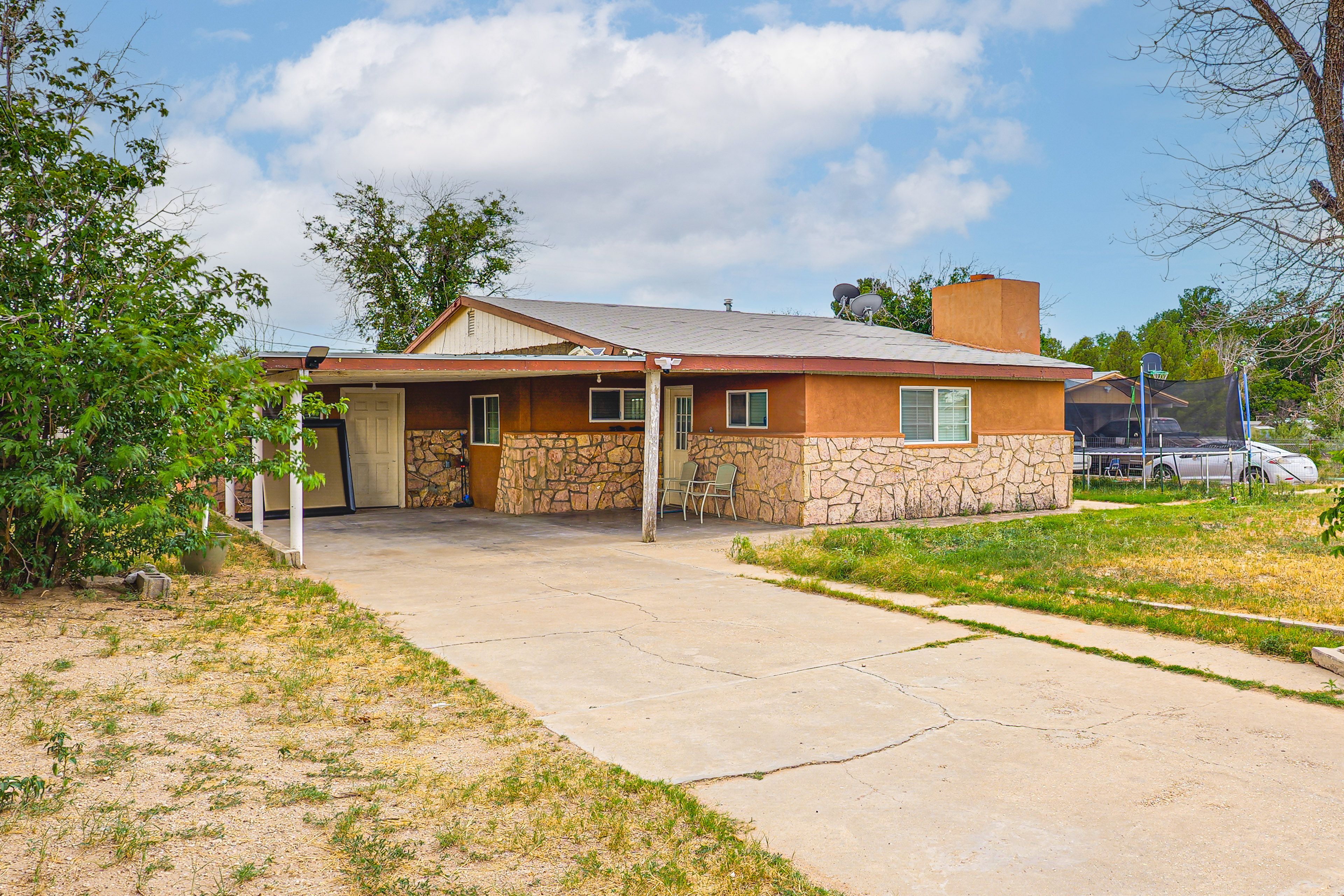 Property Exterior | Fenced-In Yard | Covered Patio w/ Seating