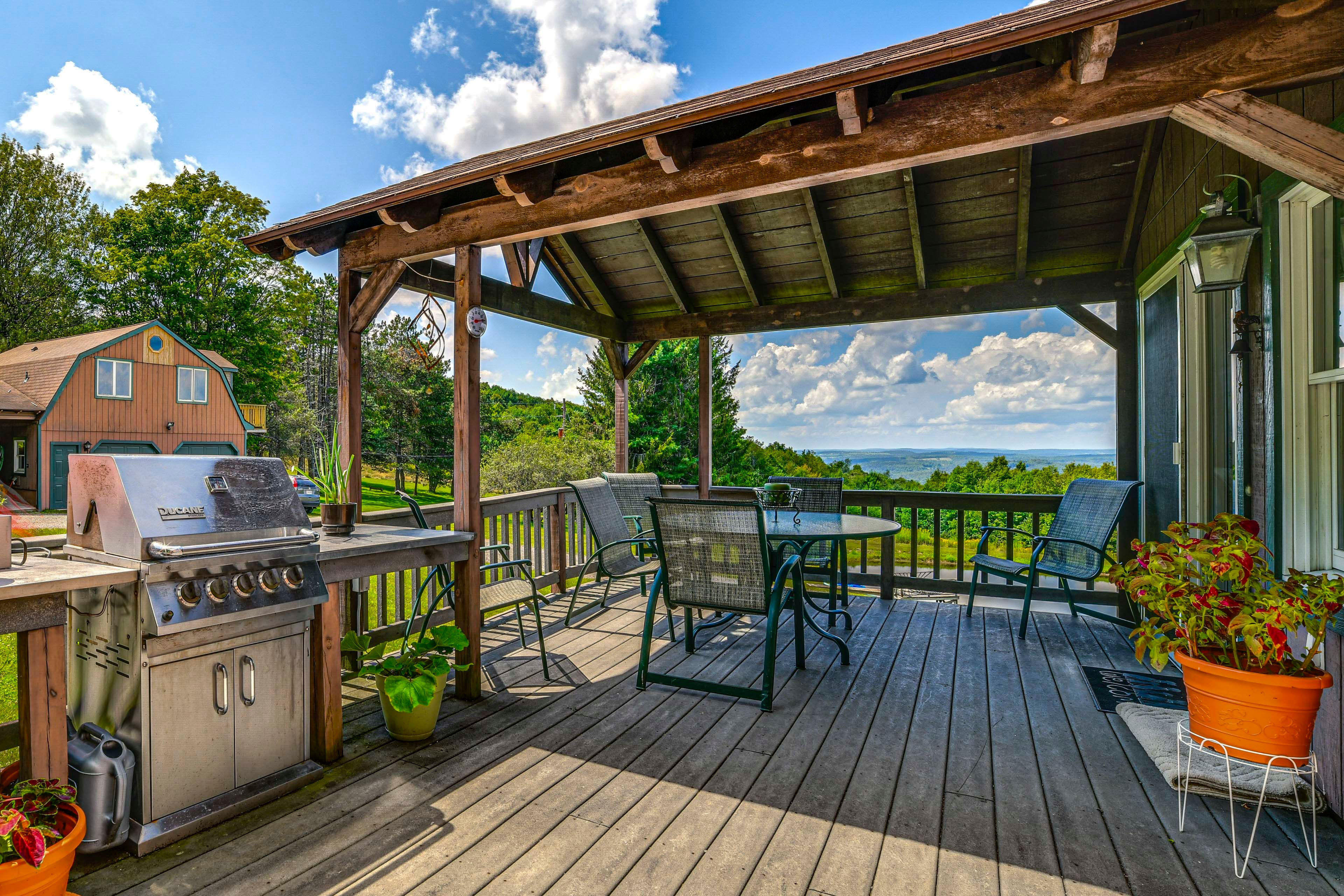 House Exterior | Covered Deck w/ Seating | Dining Area | Gas Grill