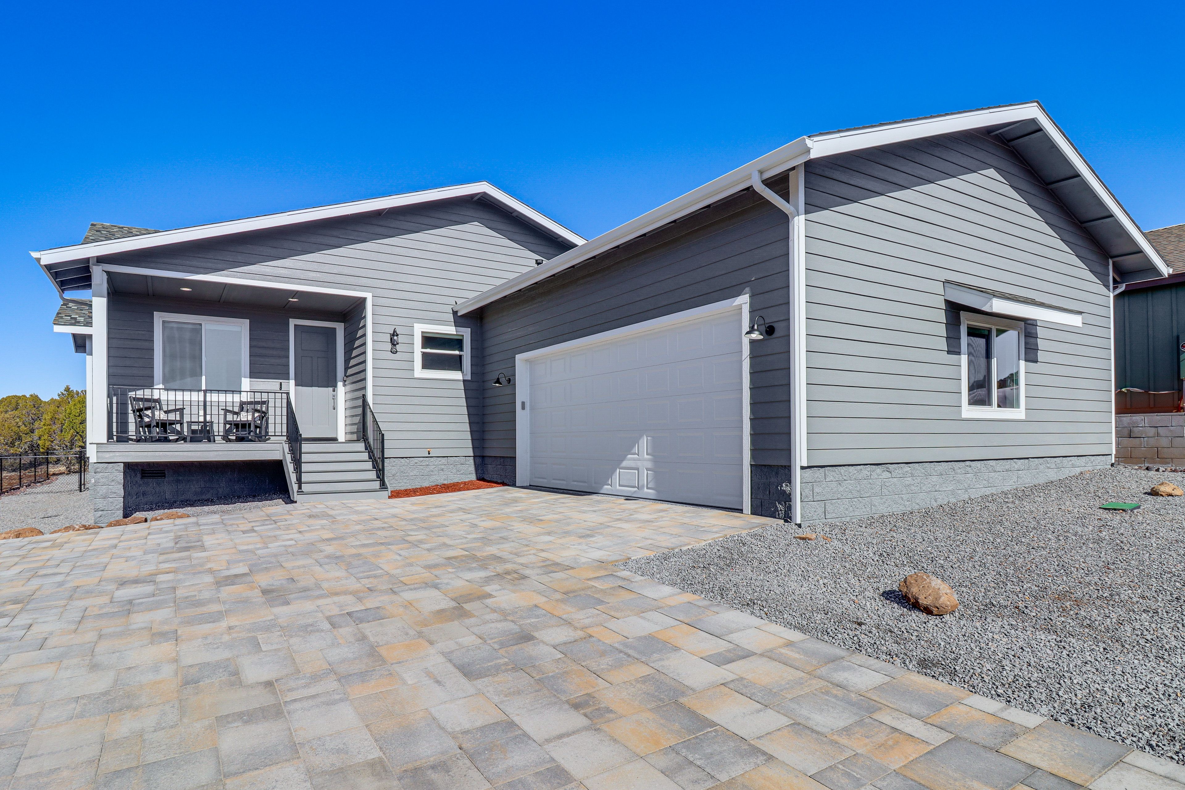 Property Exterior | Oversized Garage & Driveway (3 Vehicles Max)