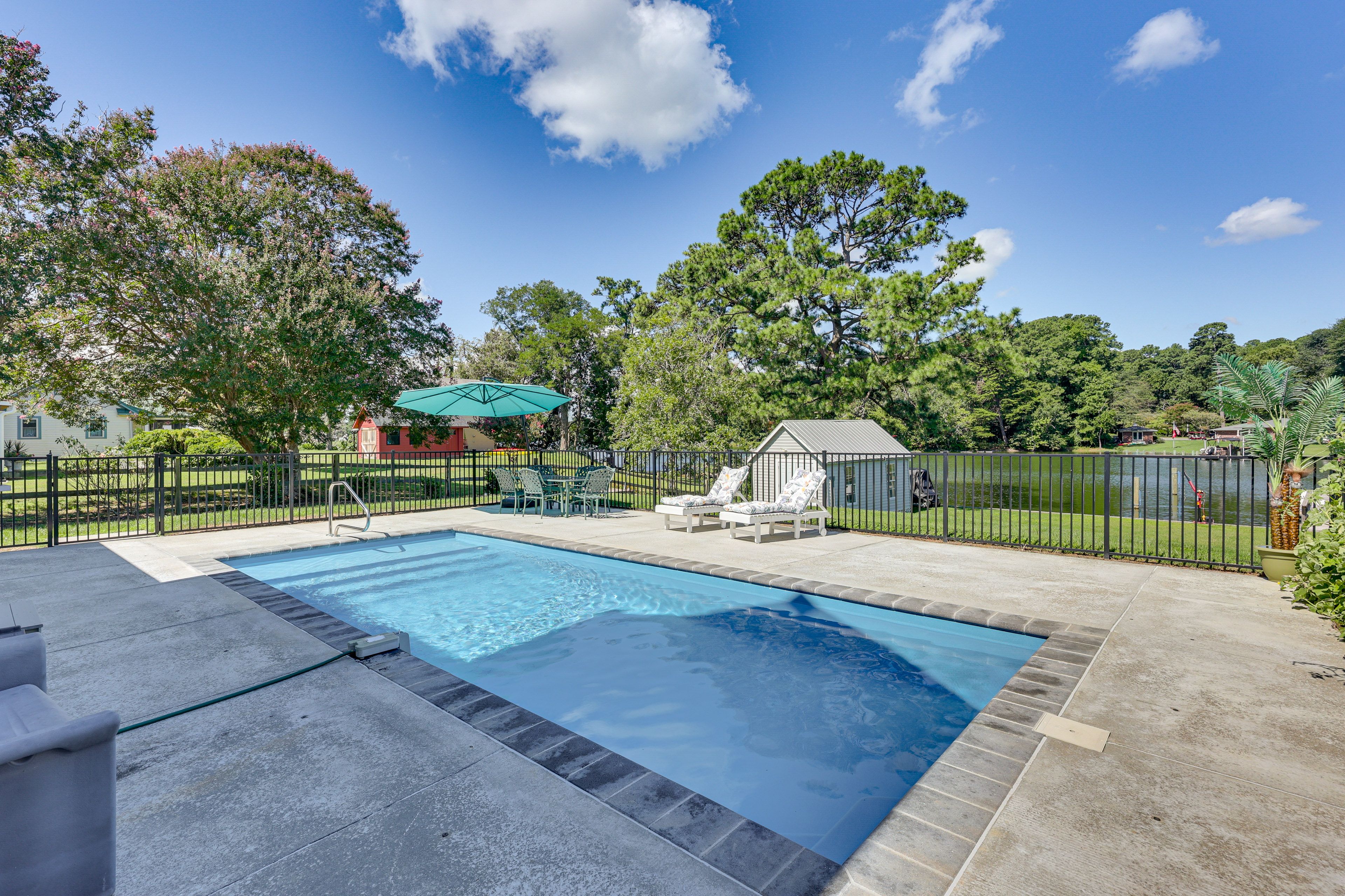Patio | Dining Area w/ Large Umbrella | Lounge Chairs | Gas Grill | Water Views