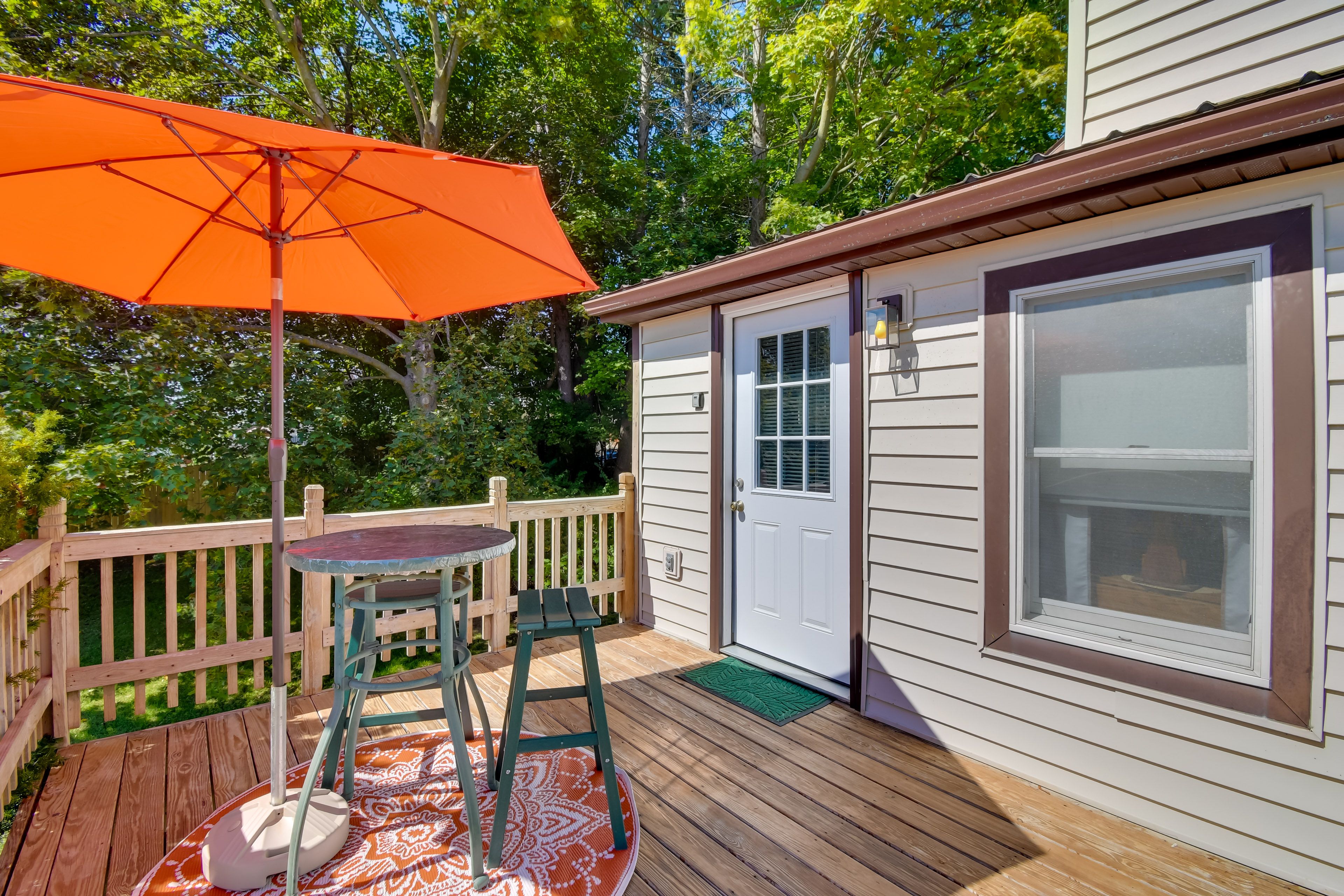 Apartment Exterior | Furnished Deck | Dining Area w/ Umbrella