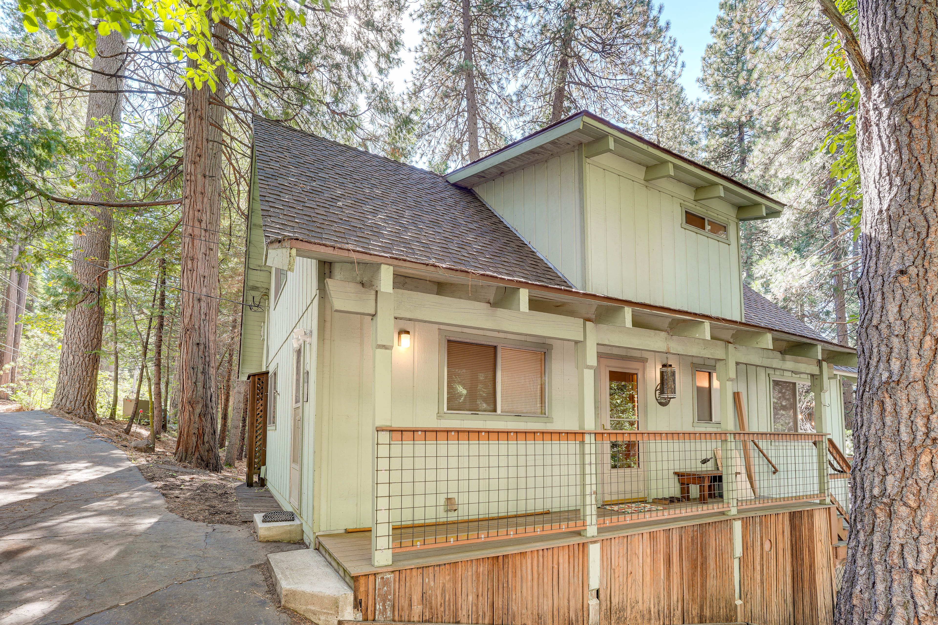 Property Exterior | Furnished Deck | Gas Fire Pit & Grill | Wooded Surroundings