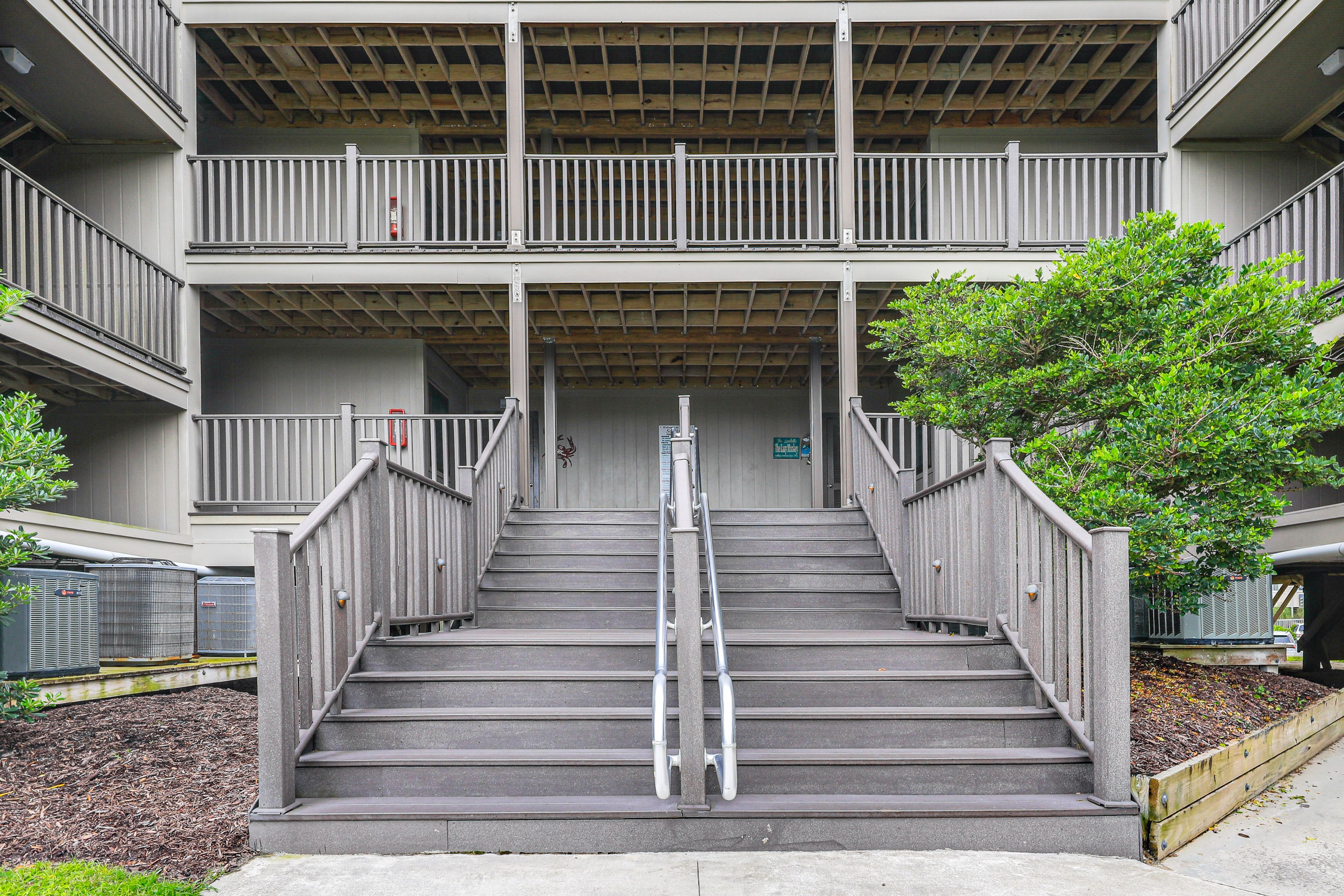 Condo Exterior | Parking | Community Lot (First-Come, First-Served)