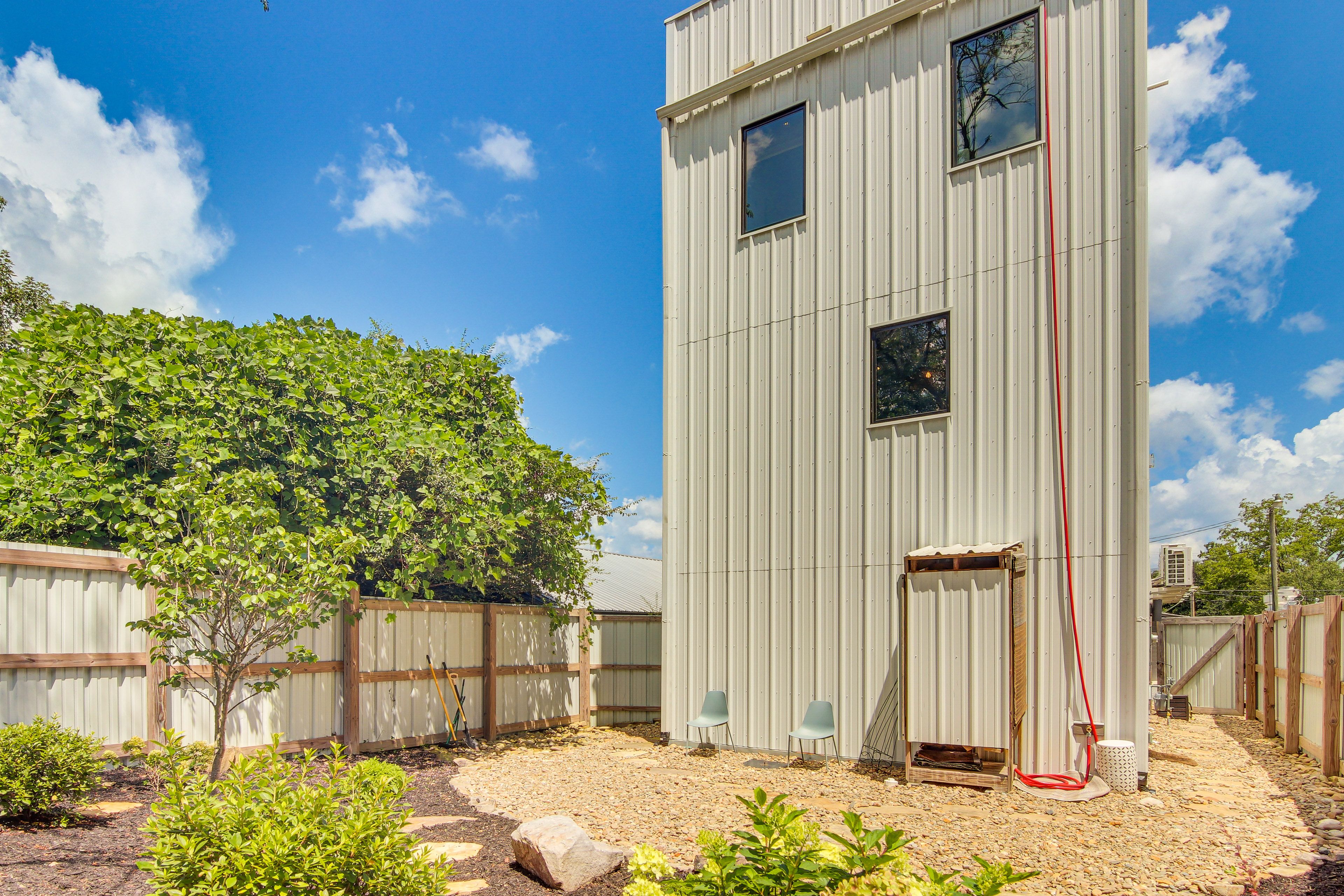 House Exterior | Fenced Backyard w/ Seating | Shower