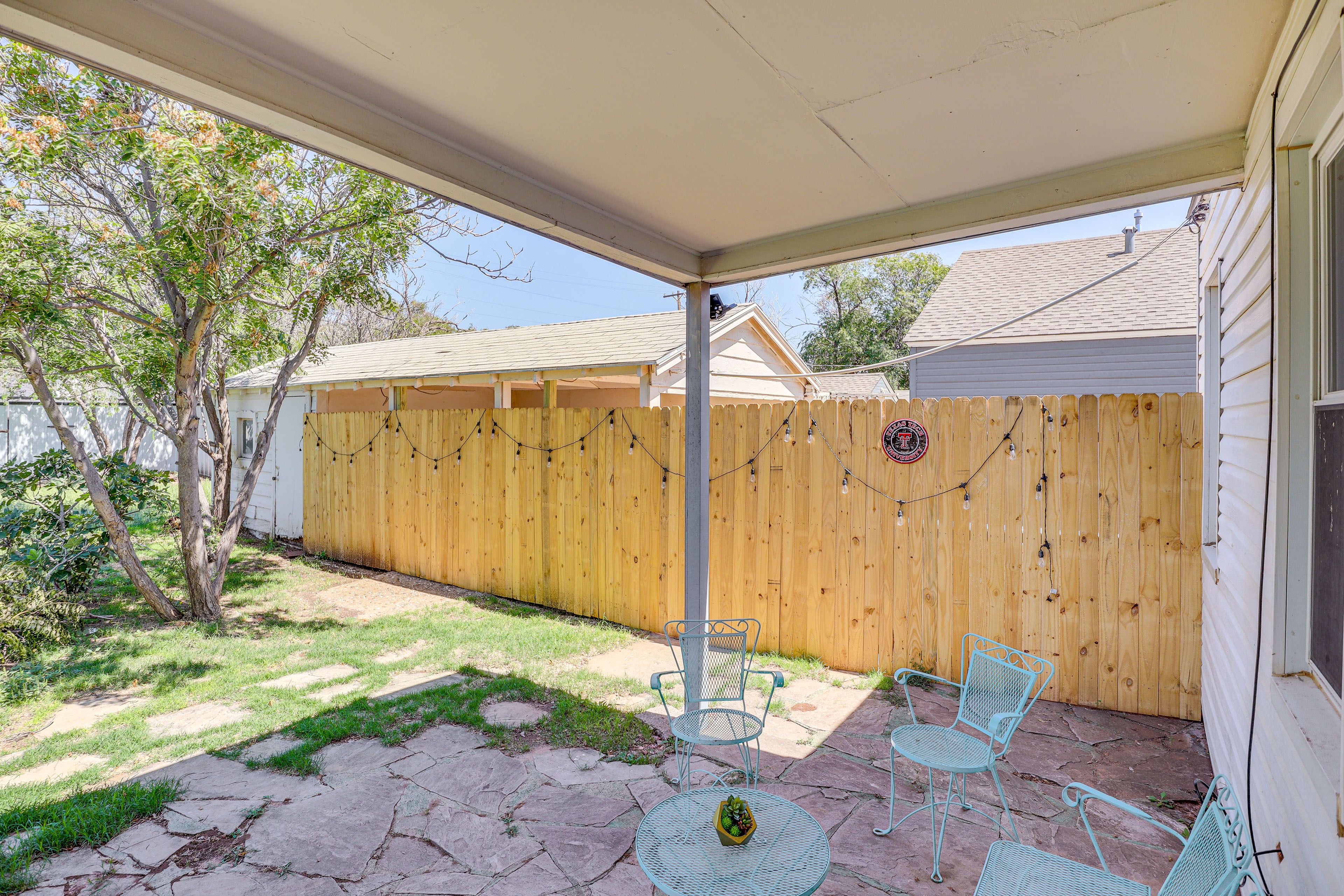House Exterior | Covered Patio w/ Seating | Fenced Backyard