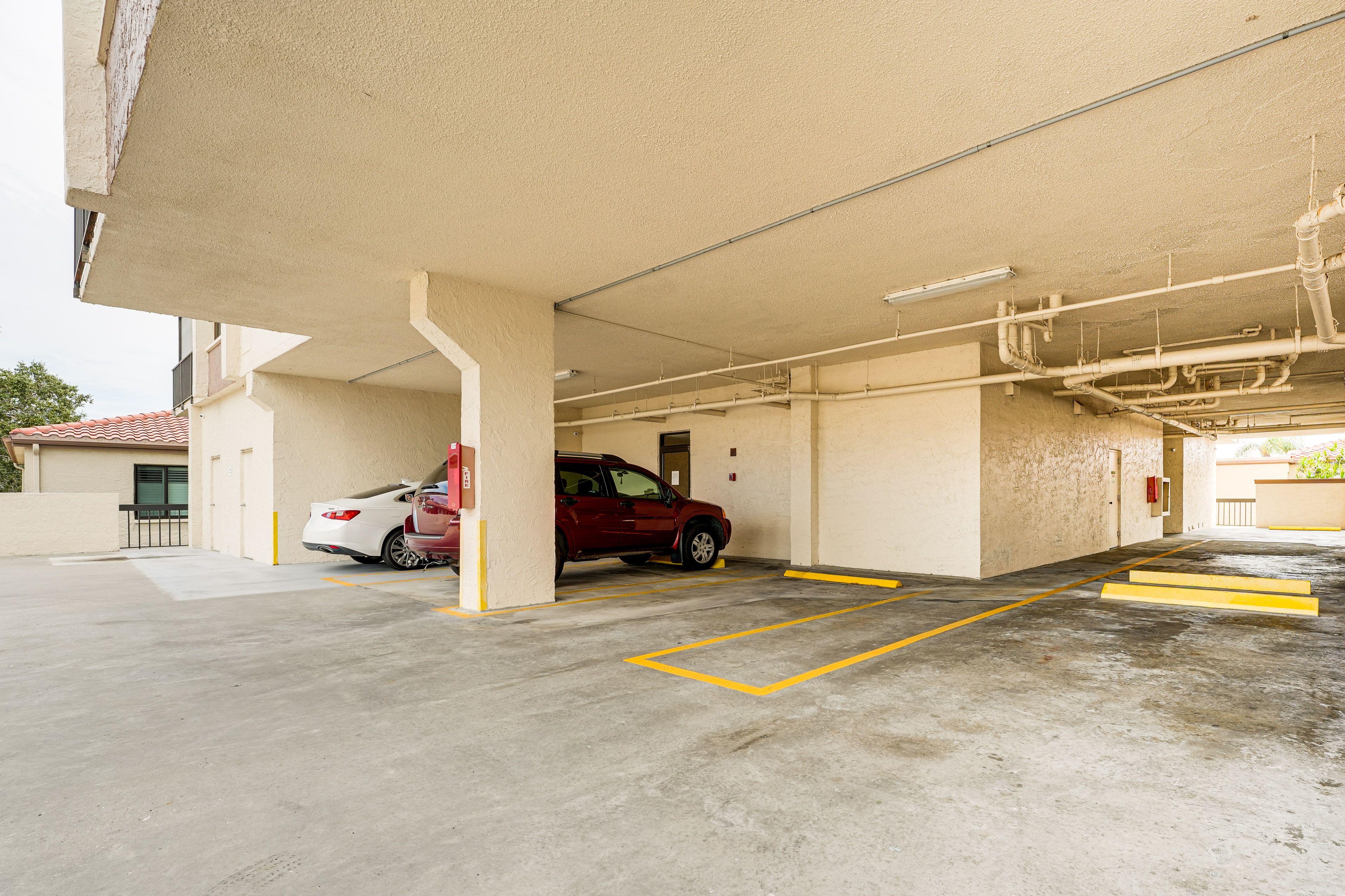 Parking | Designated Parking Space (Covered; 1 Vehicle) | Guest Parking Spaces