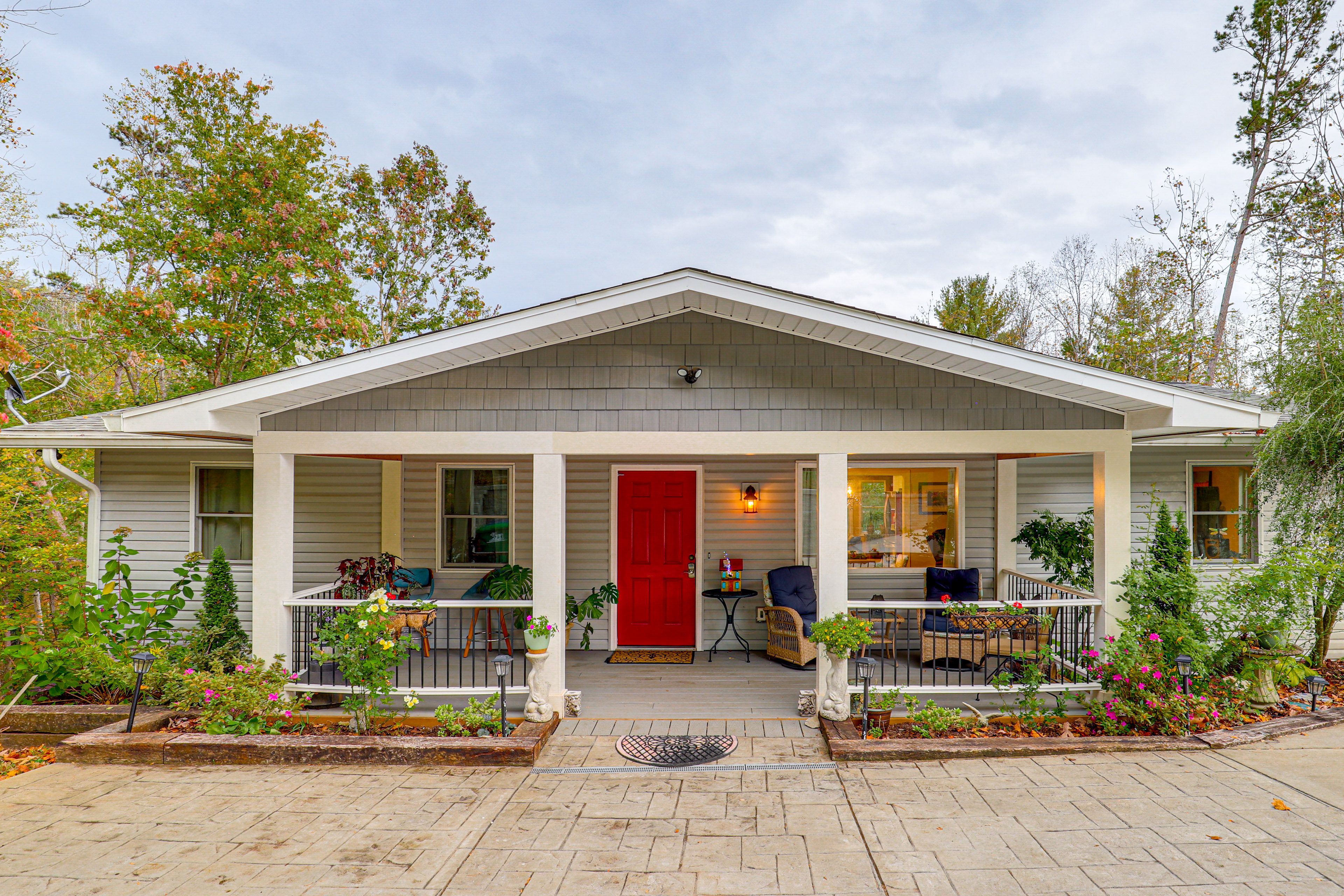 Property Exterior | Covered Porch w/ Seating | Furnished Deck | Mountain Views