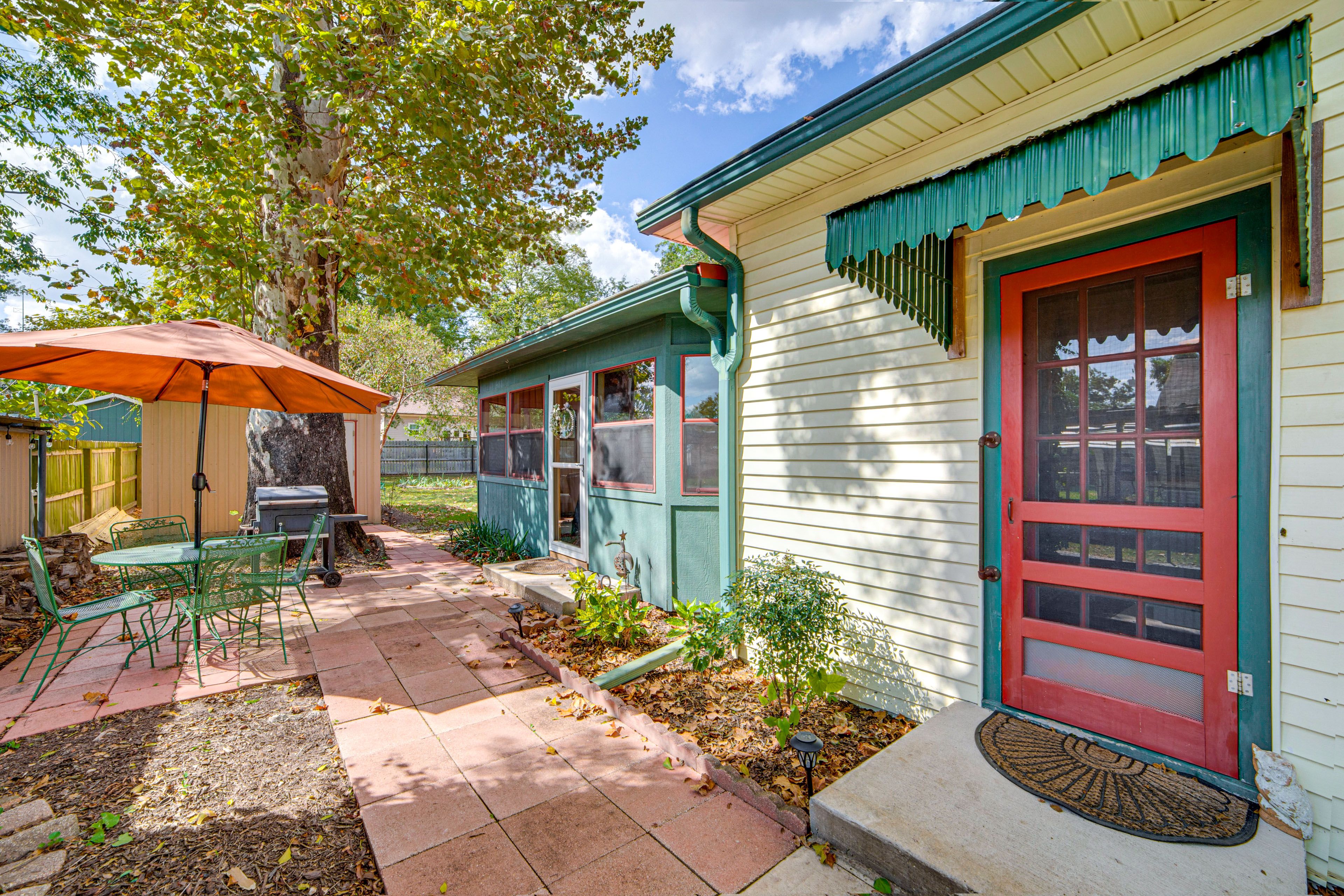 Patio | Dining Area w/ Umbrella | Charcoal Grill