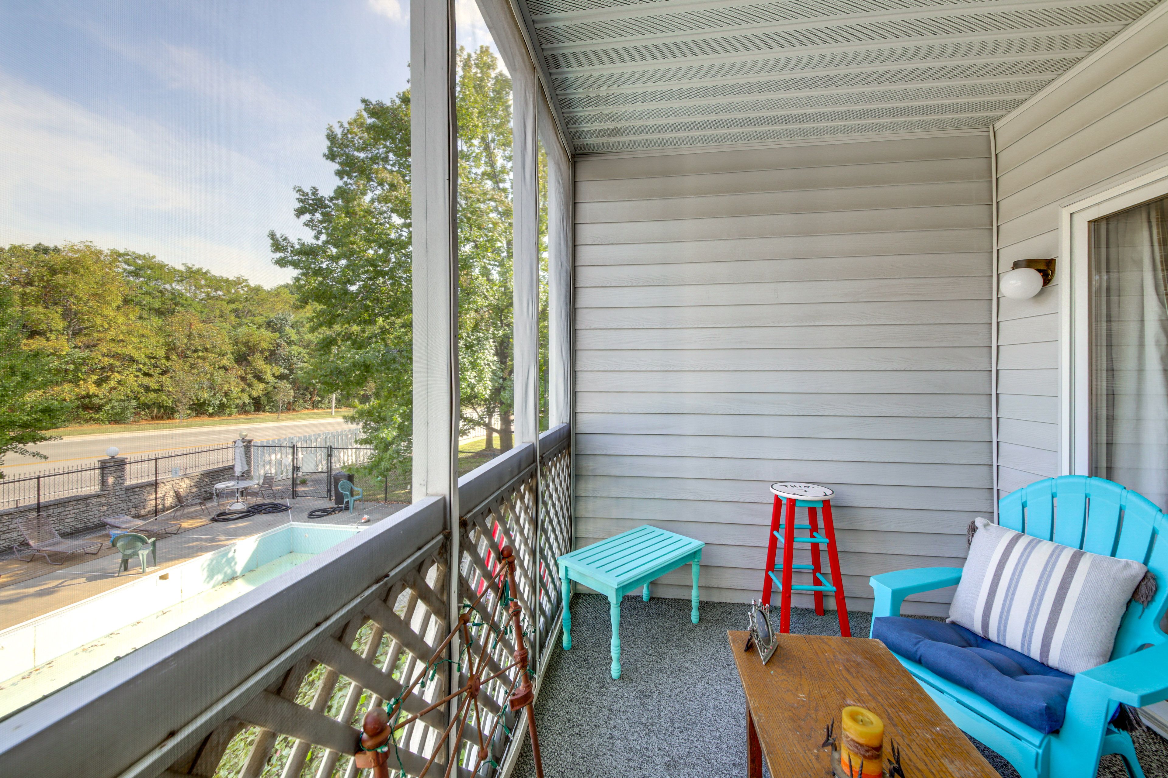 Condo Exterior | Screened Balcony w/ Seating | Pool View