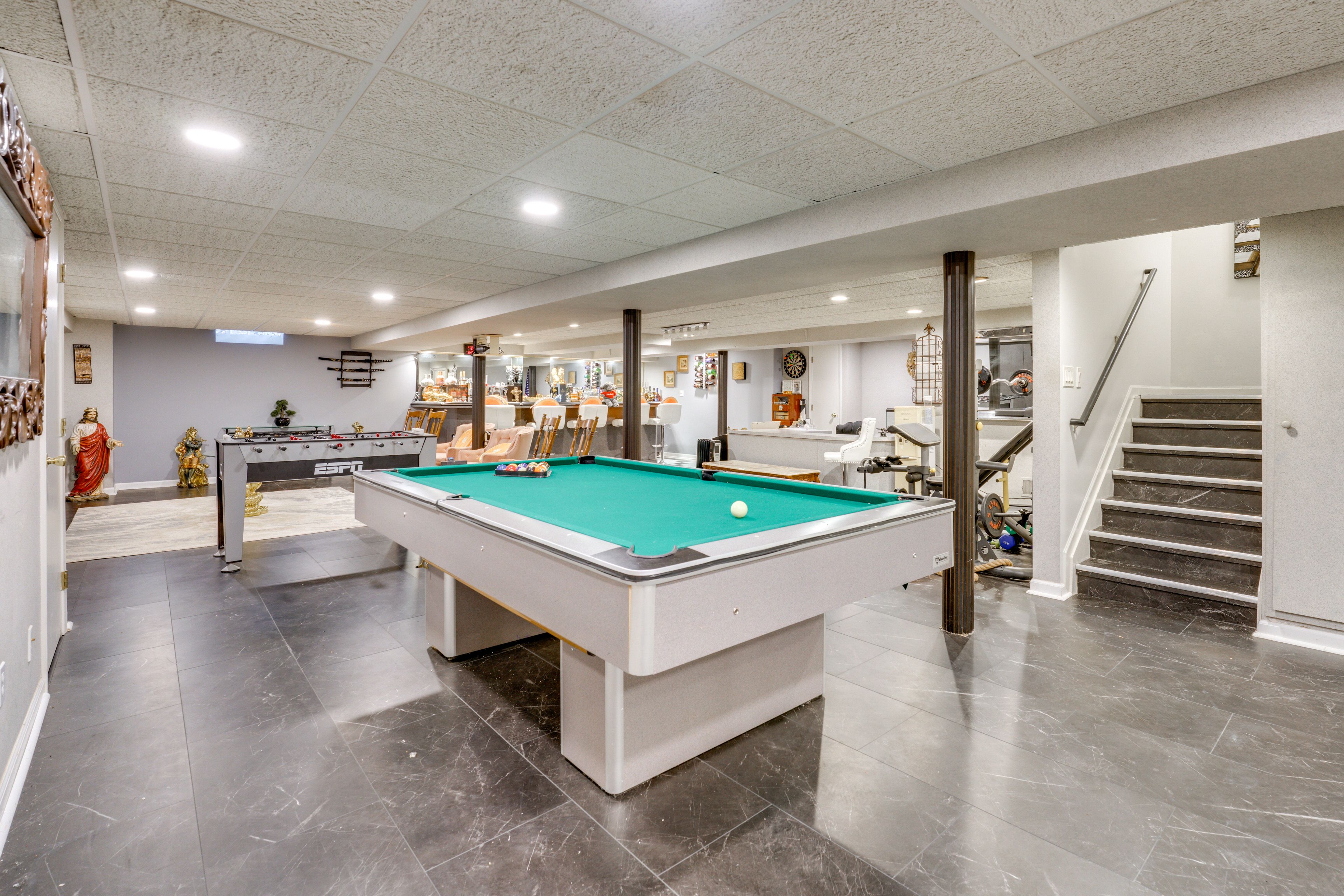 Basement Lounge | Fitness Equipment | Bar | Movie Projector