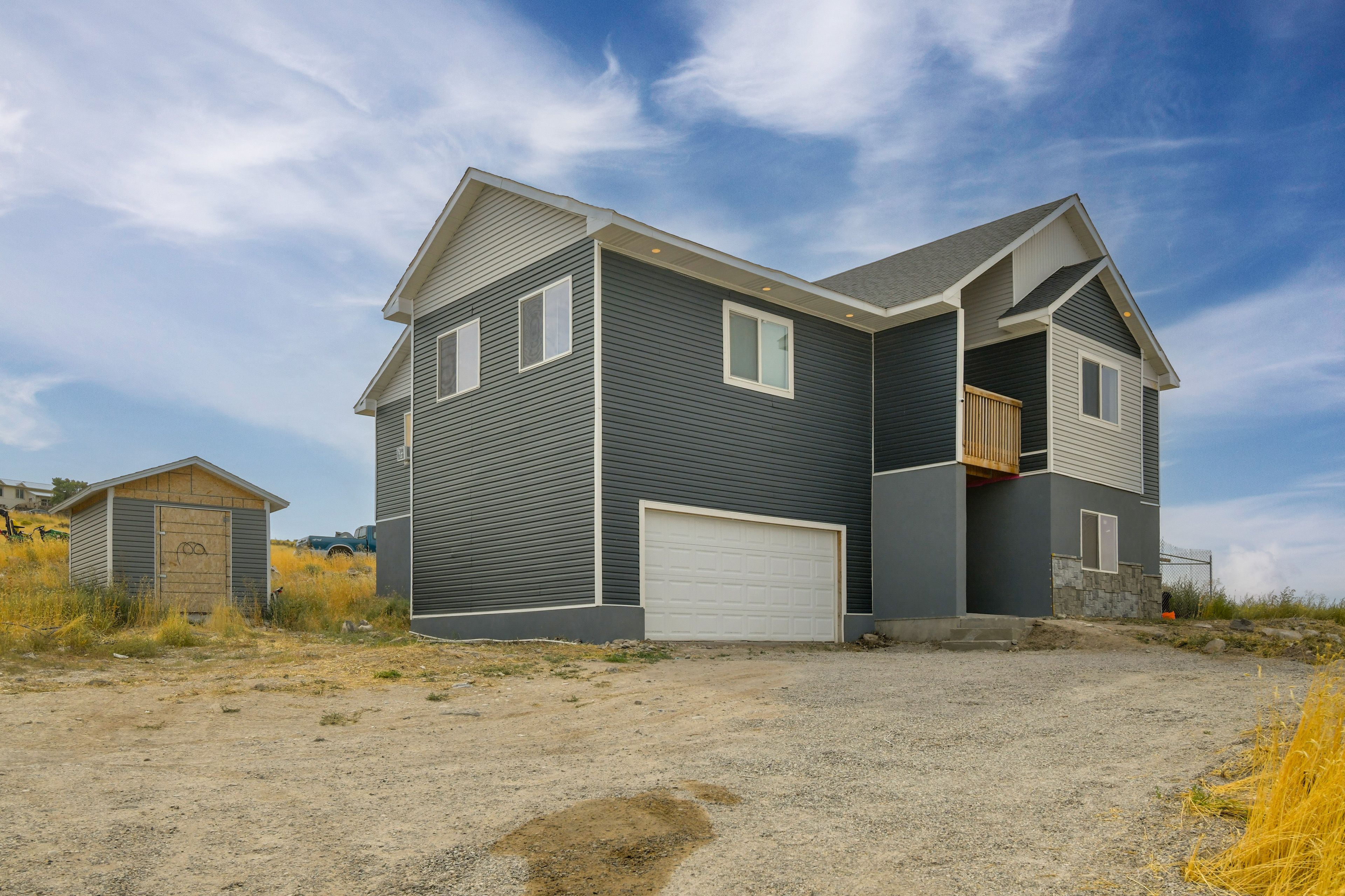 Building Exterior | 2nd-Floor Unit | Driveway Parking (4 Vehicles)