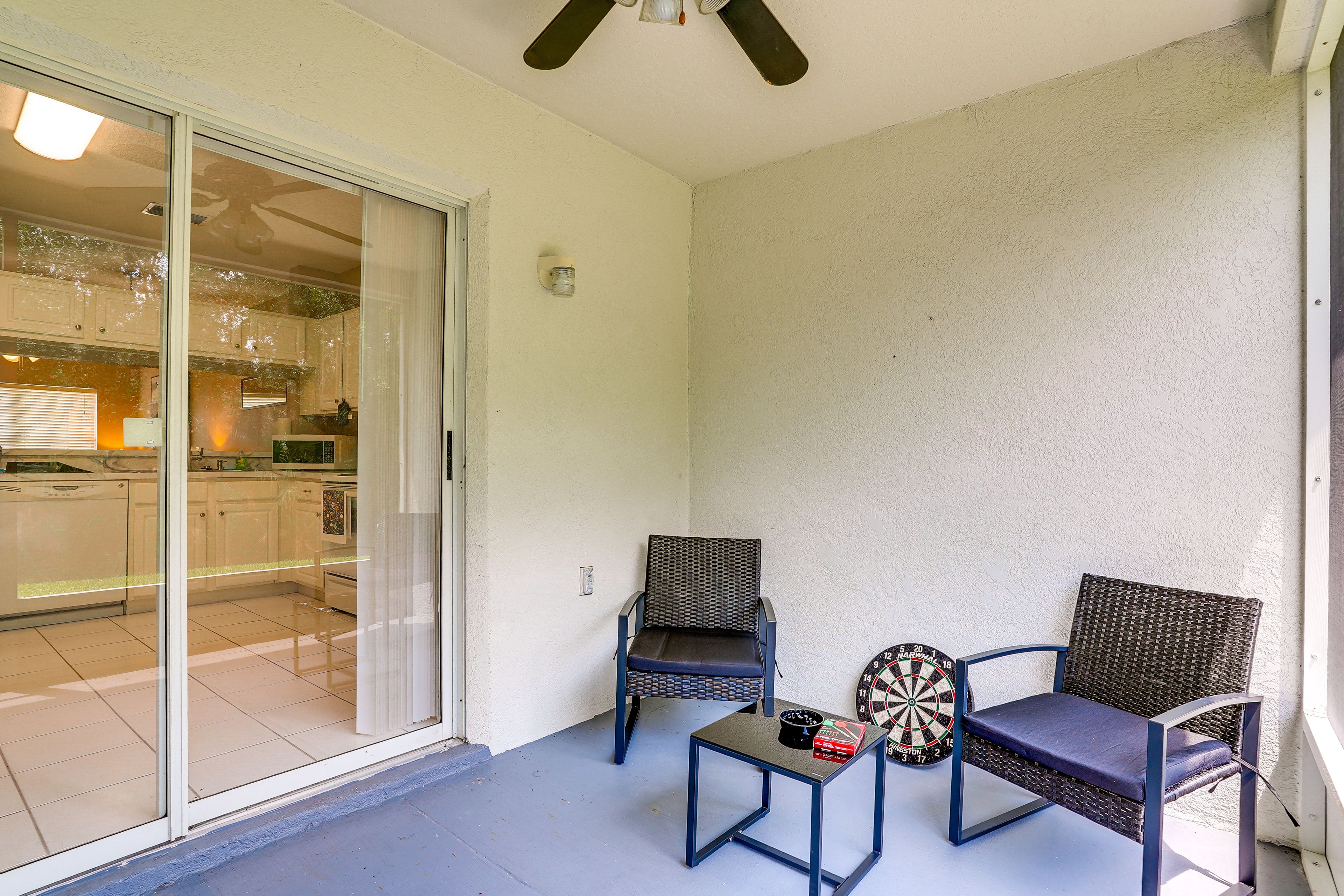 Townhome Exterior | Screened Patio w/ Seating | Dartboard