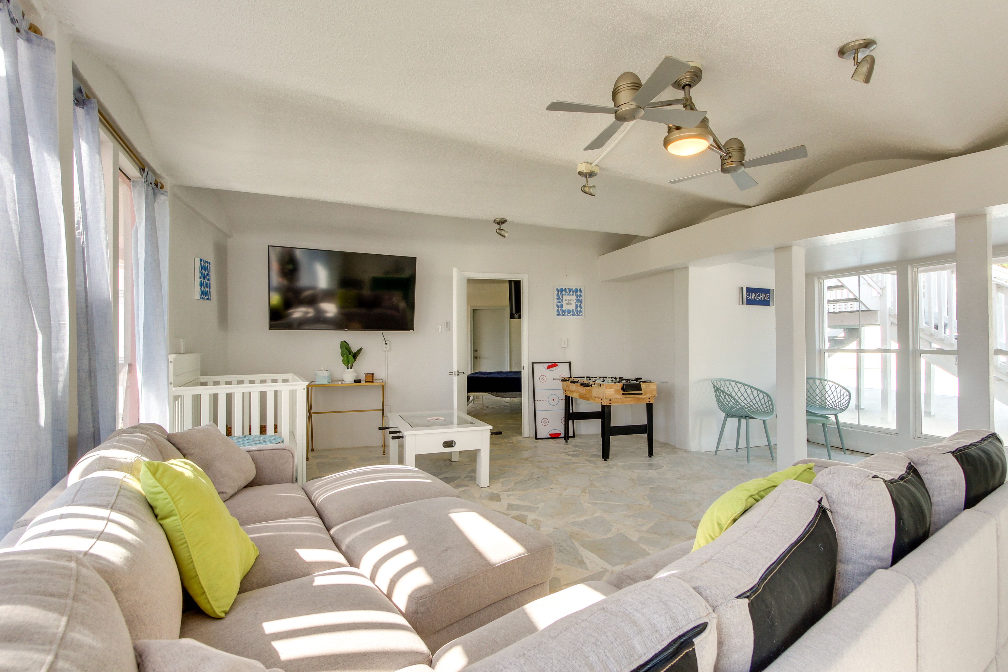 Family Room | Smart TV | Crib | Reversible Air Hockey/Foosball Table | 1st Floor