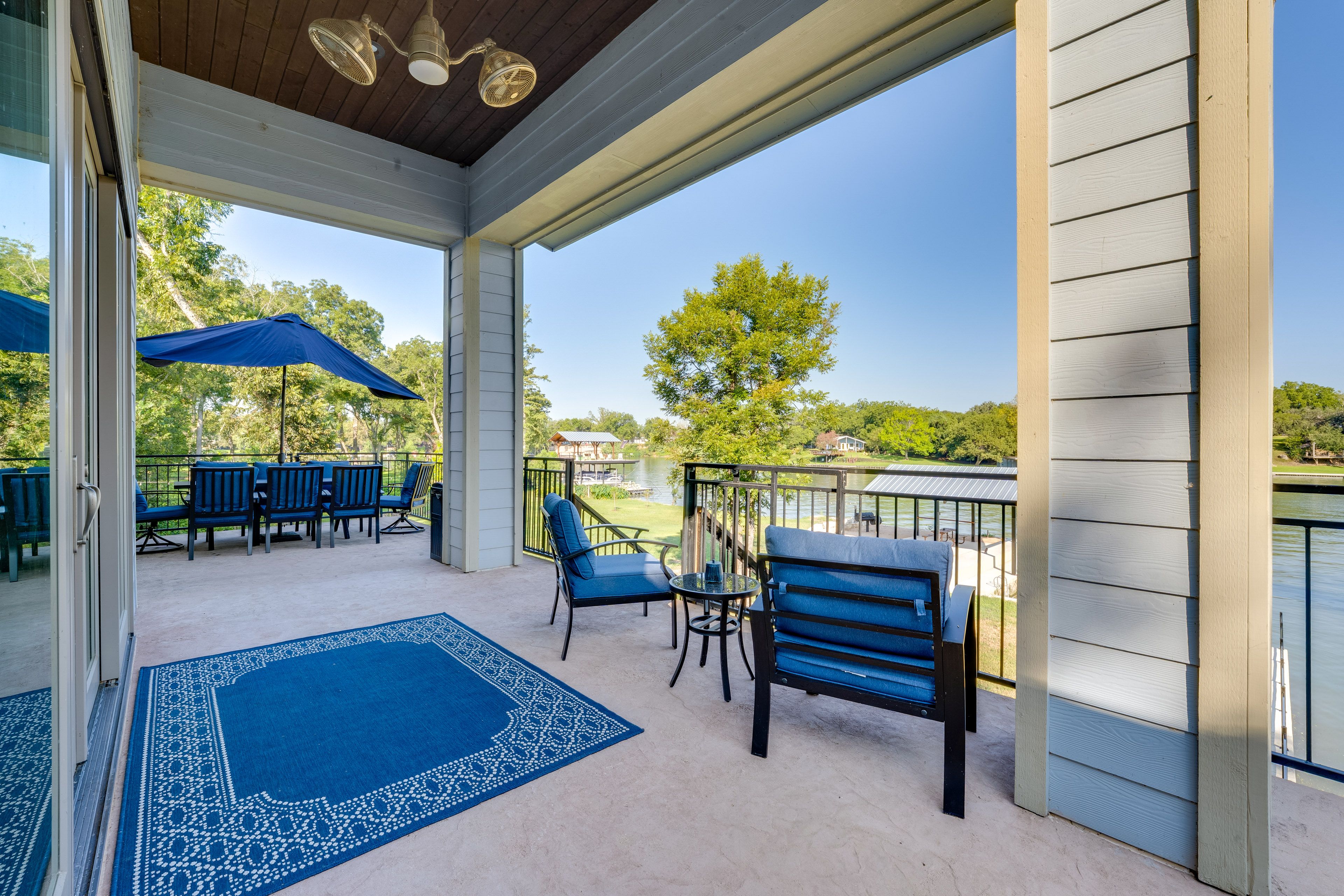 House Exterior | Furnished Balcony | Dining Area w/ Umbrella