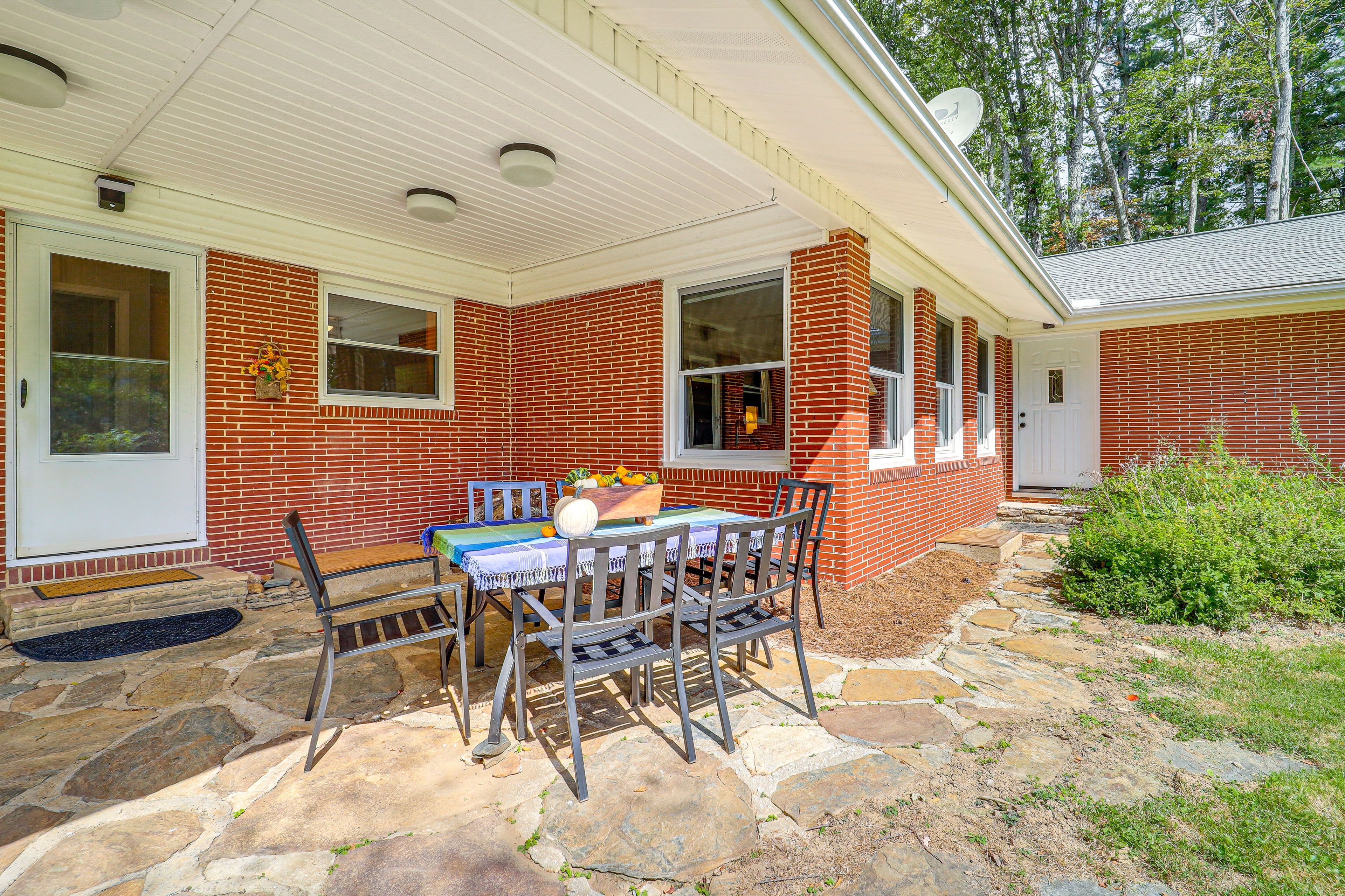 House Exterior | Covered Patio w/ Dining Area