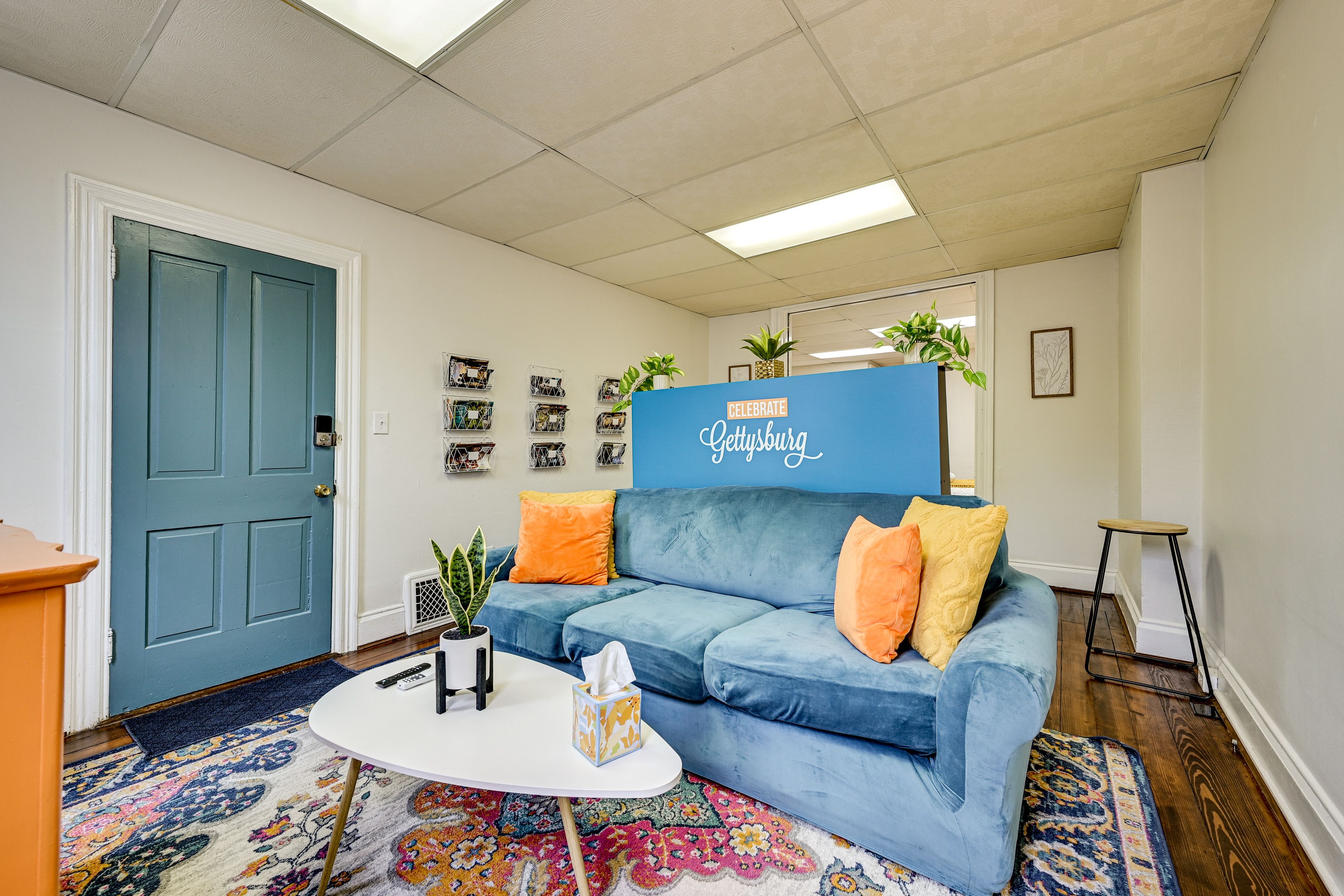 Living Room | Smart TV | Baseboard Heating | Window A/C Unit | Books