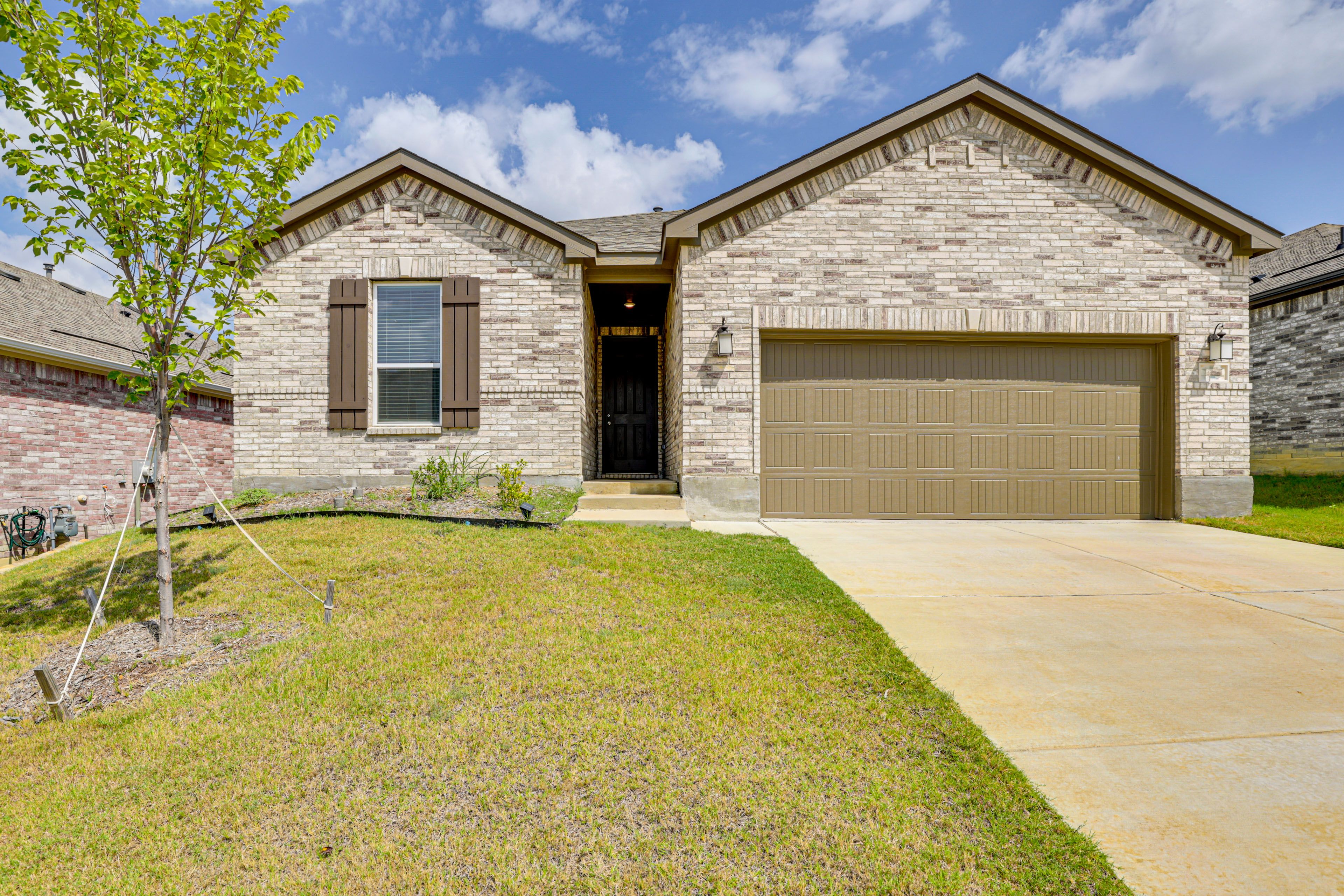 Property Exterior | Fenced-In Yard | Covered Patio w/ Seating | Charcoal Grill