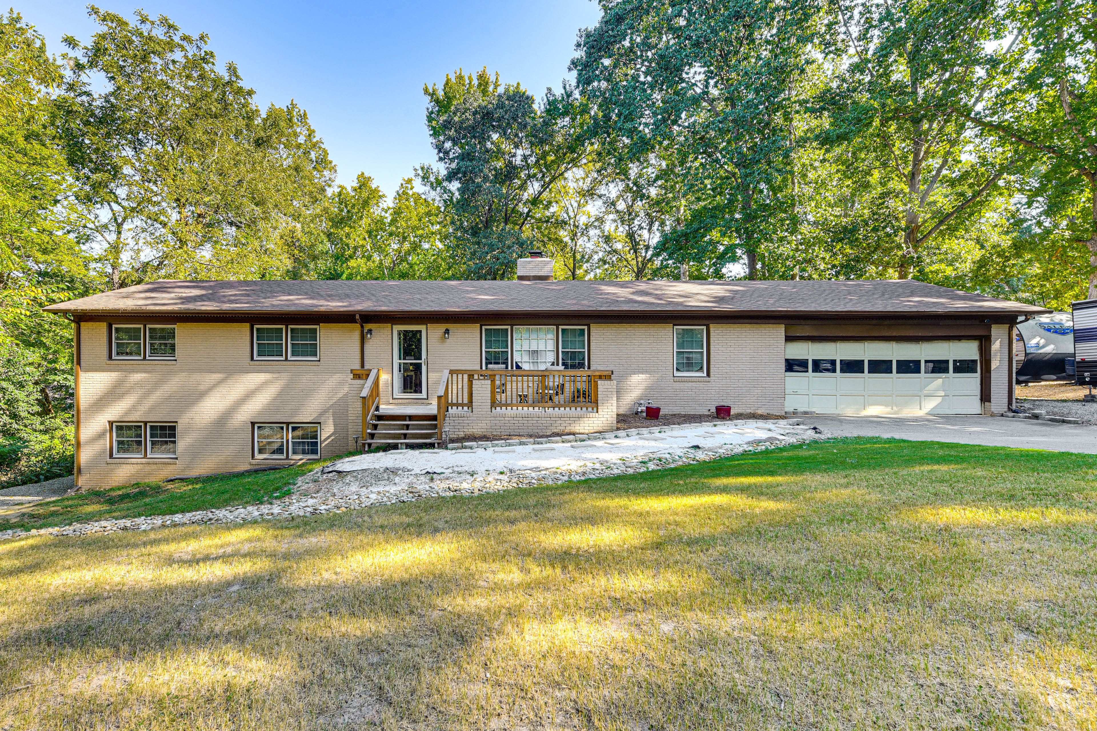 Main Home Exterior | Single-Story Apartment | Patio w/ Seating | Spacious Yard