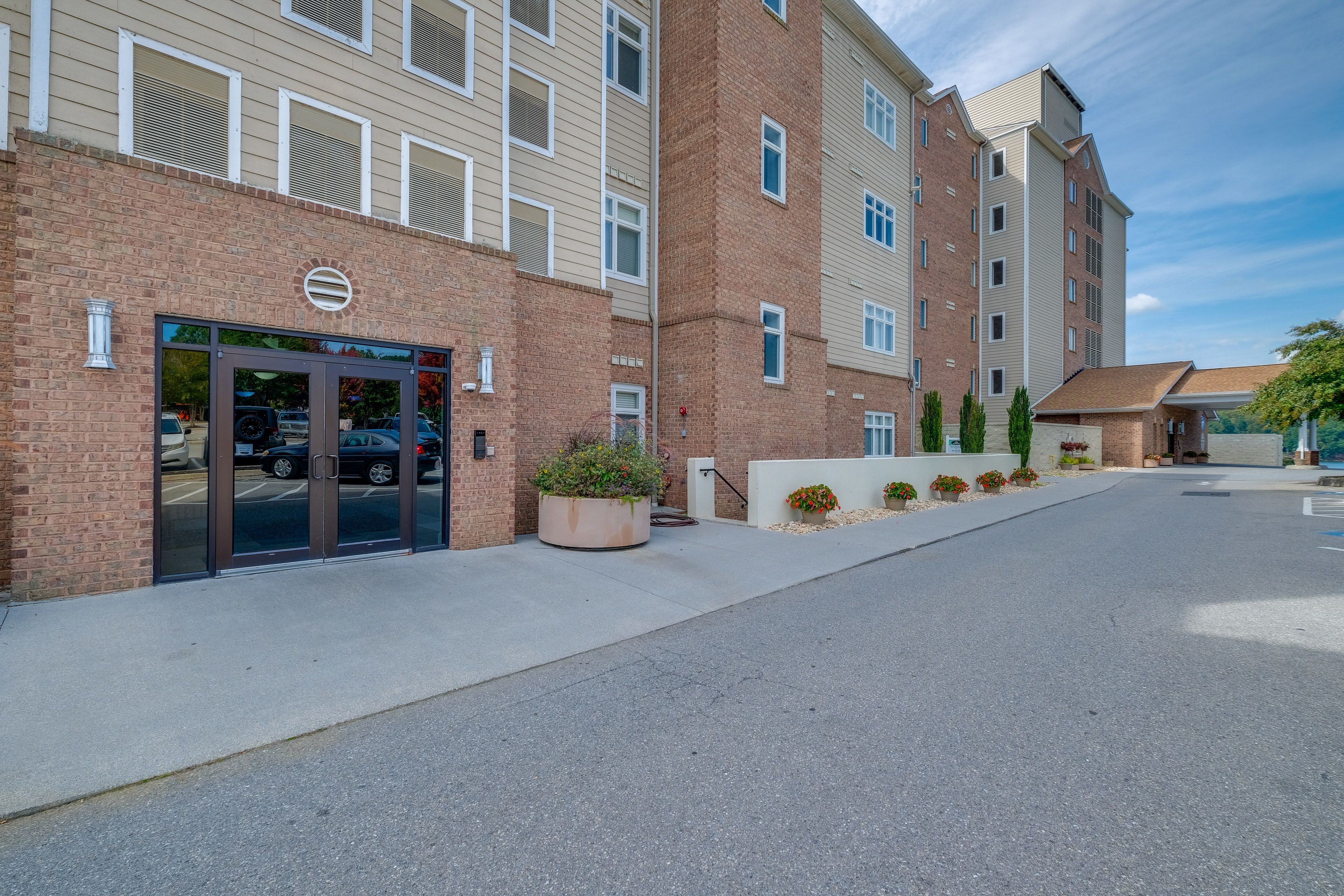 Property Exterior | Community Lot (2 Vehicles; First-Come, First-Served)