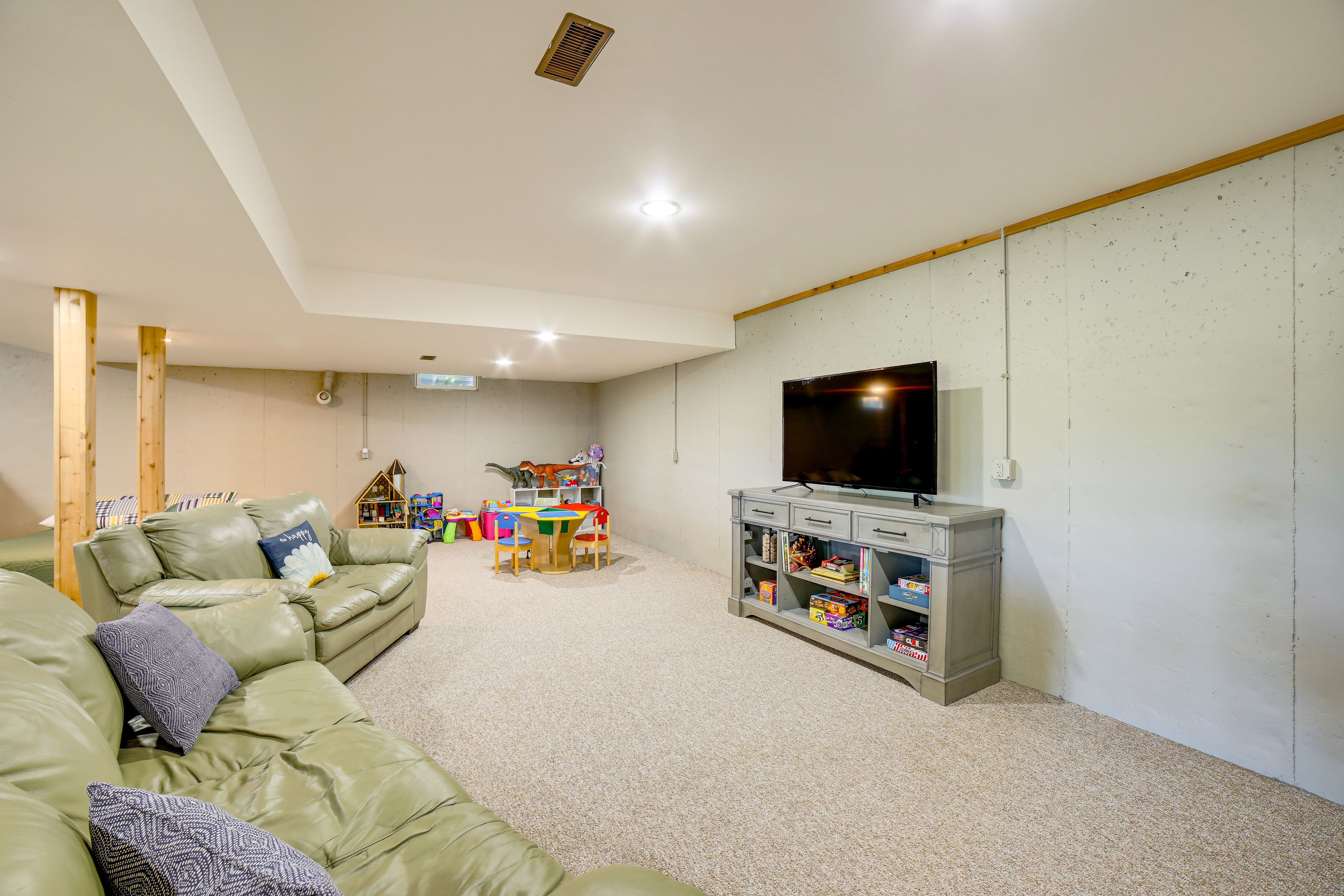 Basement Living Room | King Bed | 3 Twin Bunk Beds | Lower Level