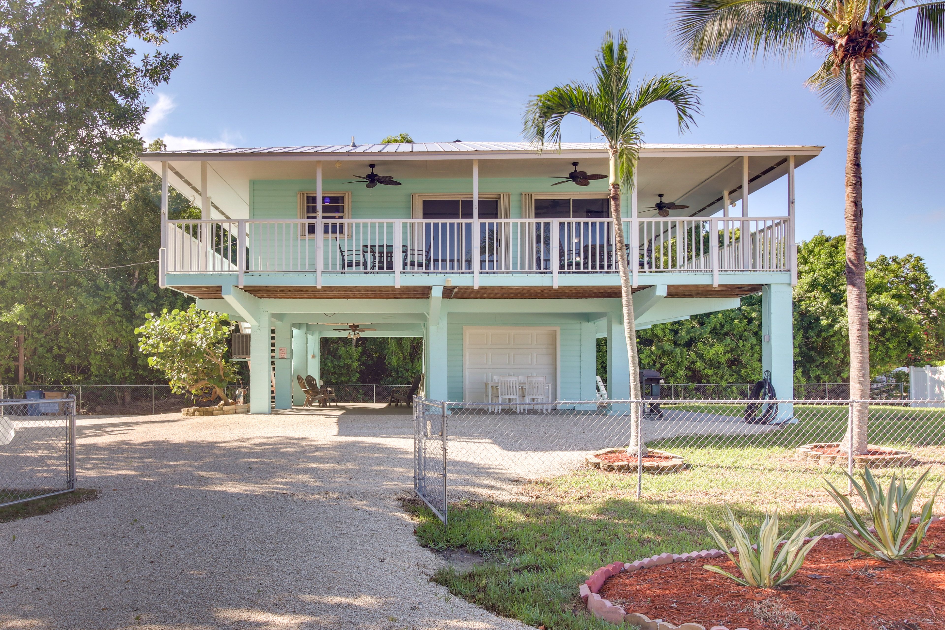 Exterior | Single-Story House | Furnished Wraparound Deck