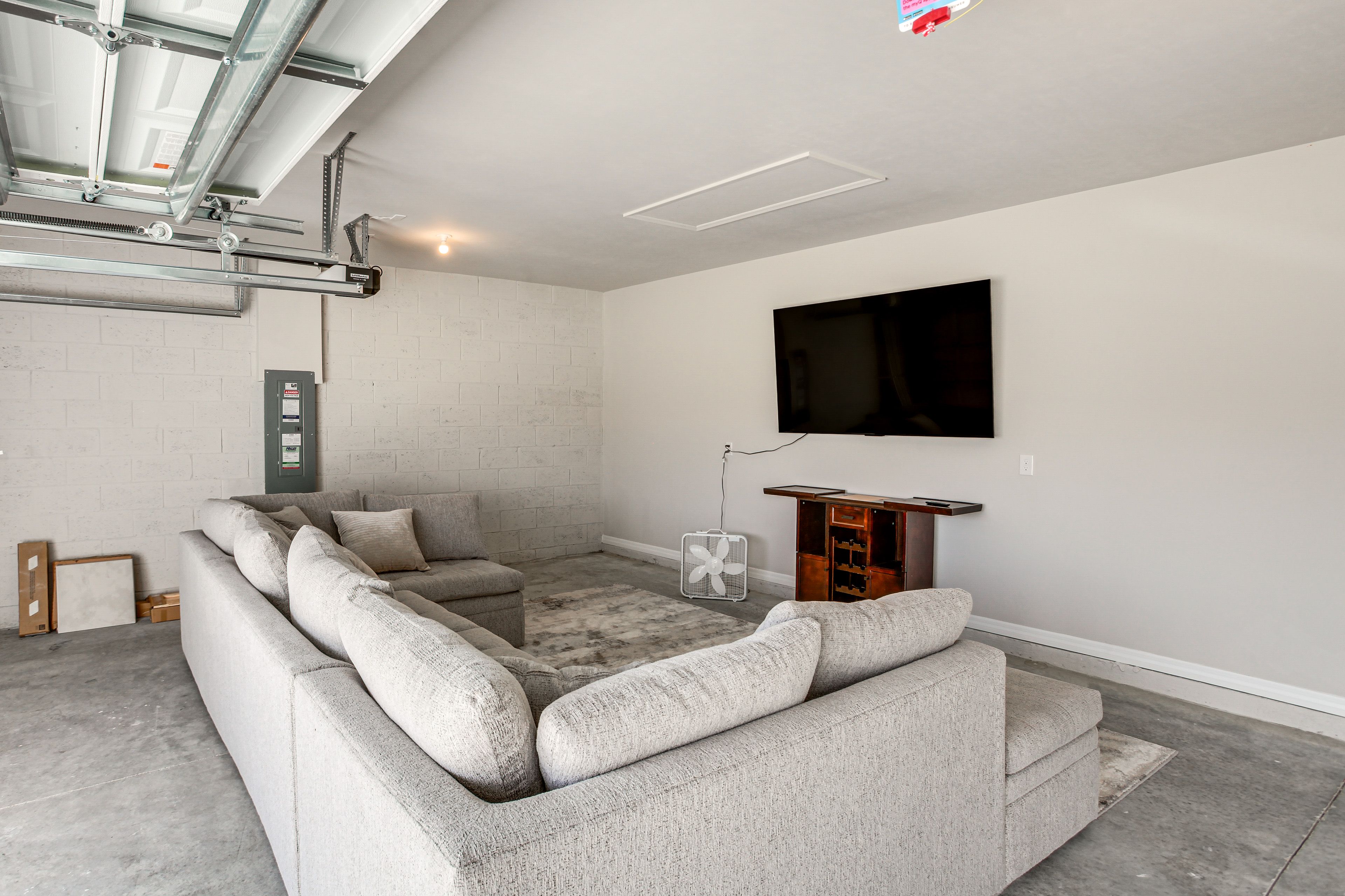 House Exterior | Garage | Couch w/ TV