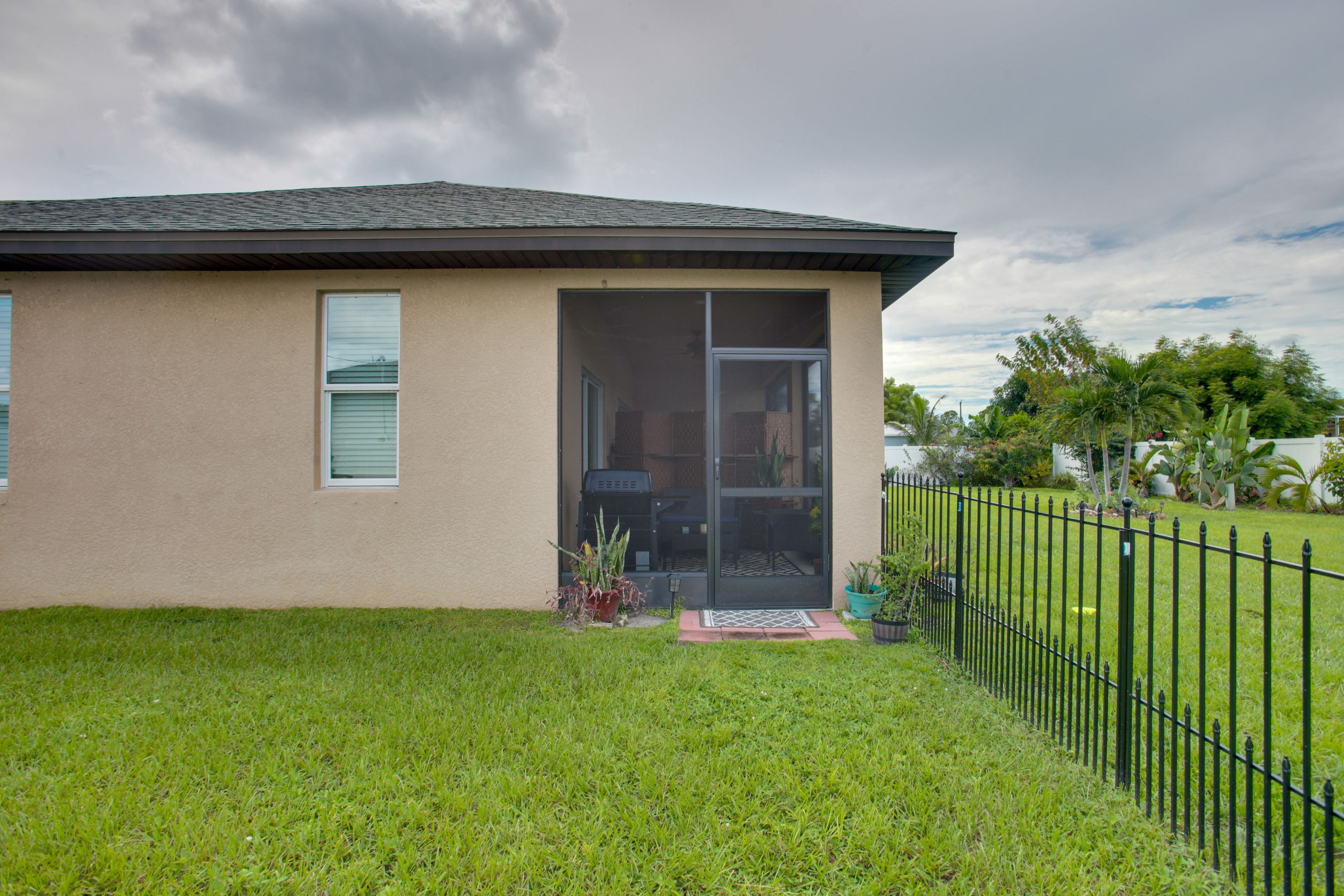 Studio Exterior | Fenced Yard w/ Garden