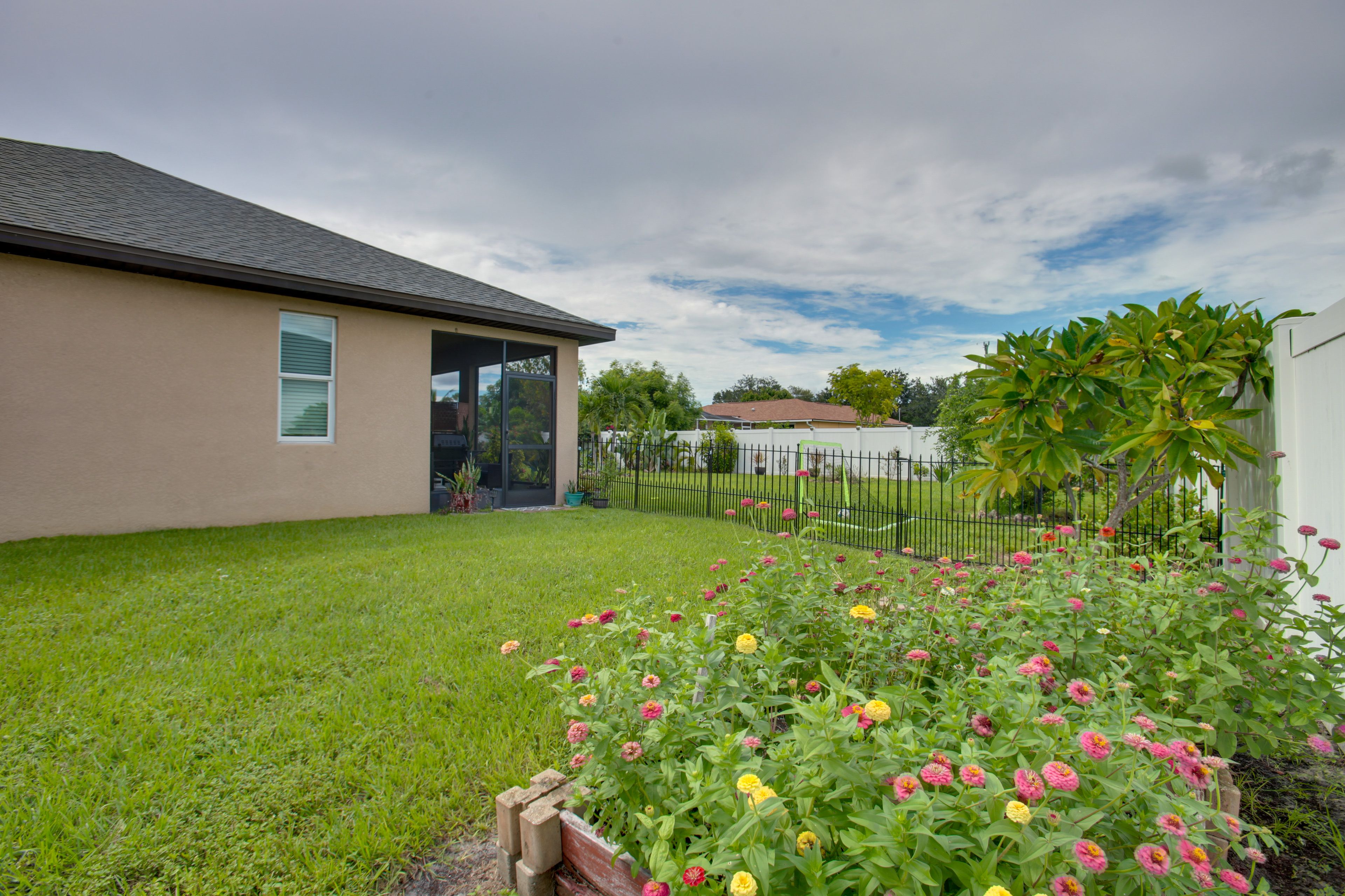Studio Exterior | Fenced Yard w/ Garden