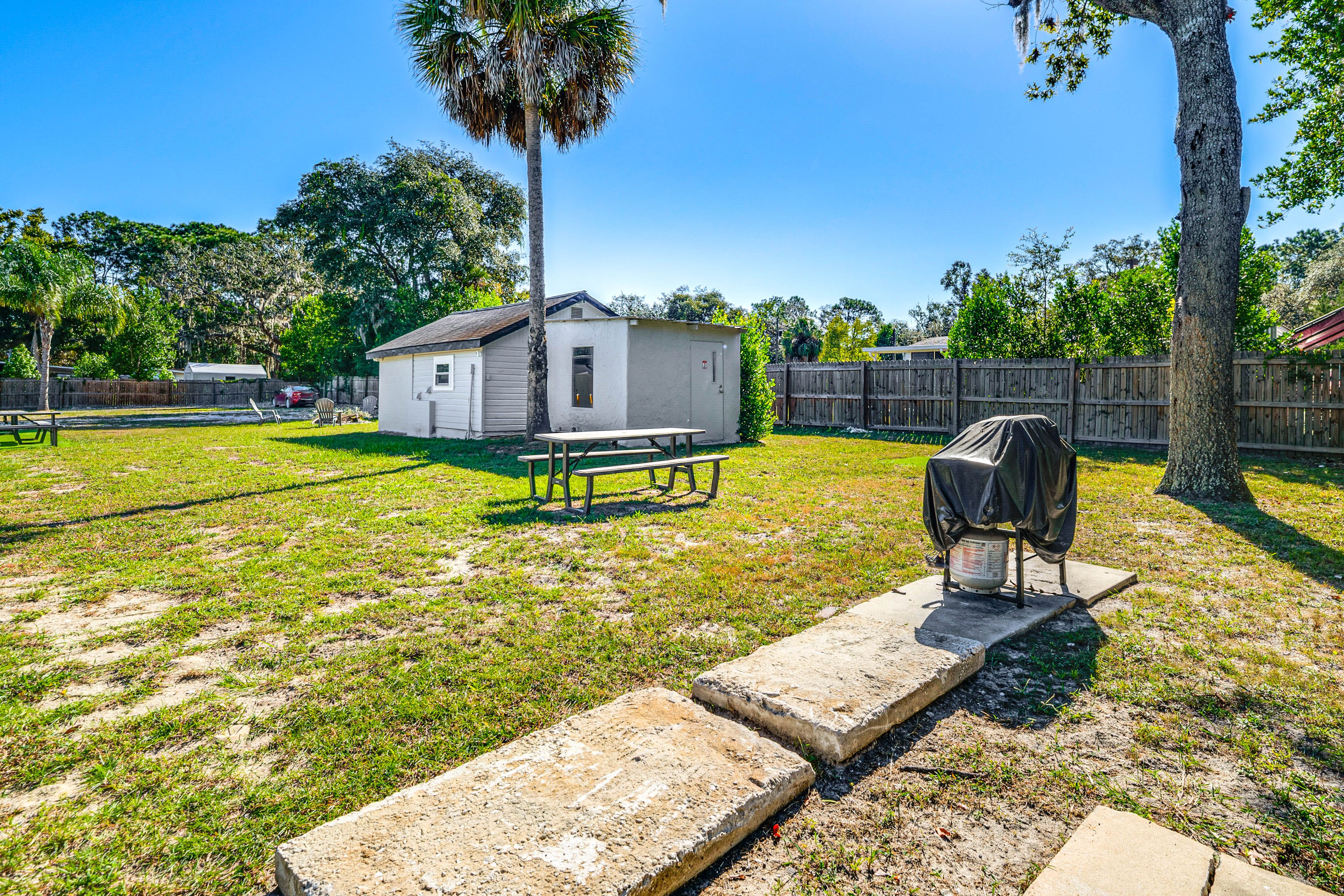 Crystal River Resort | Shared Amenities | Yard w/ Picnic Tables & Gas Grills