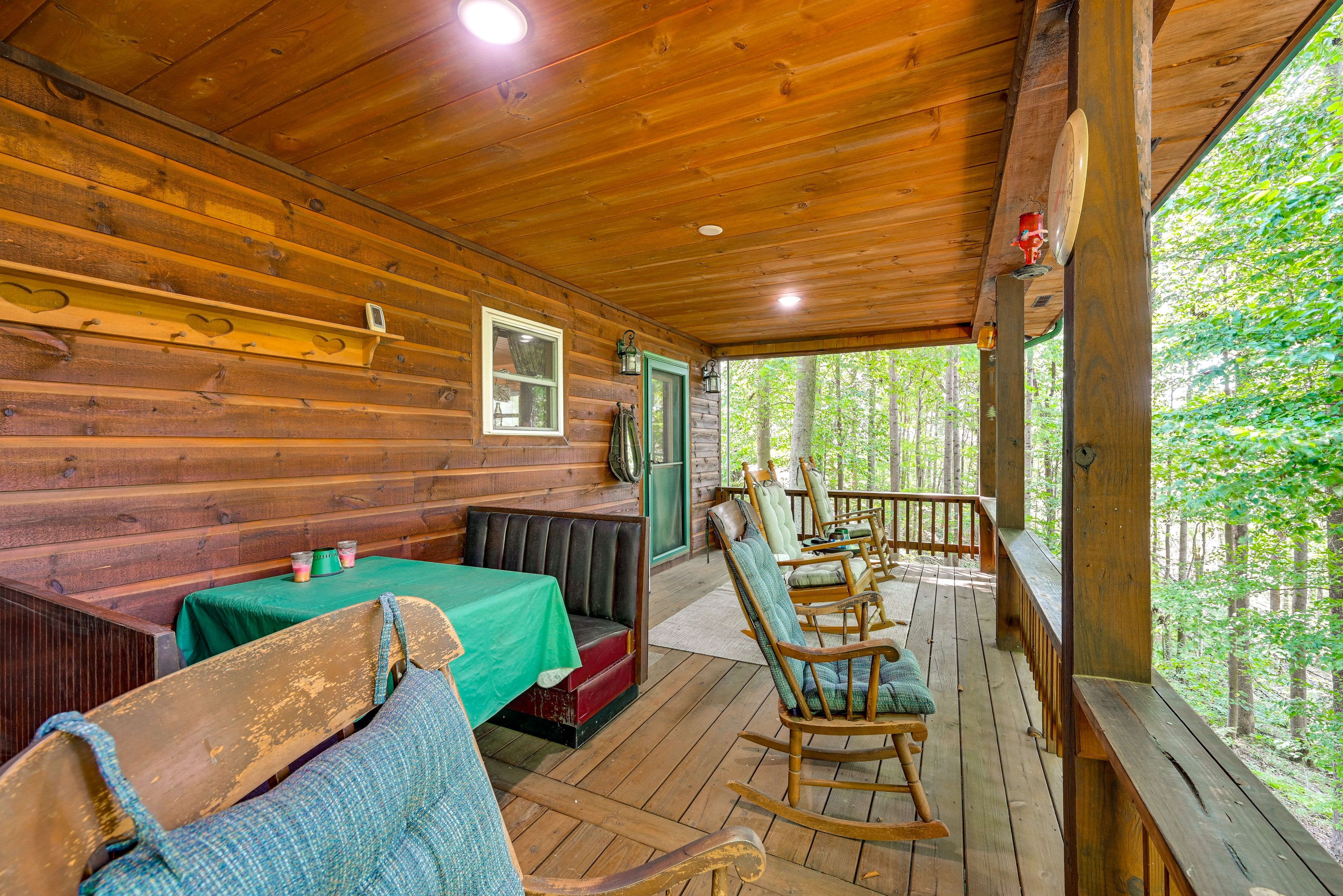 Covered Deck | Dining Booth | Grilling Area | Forest Views