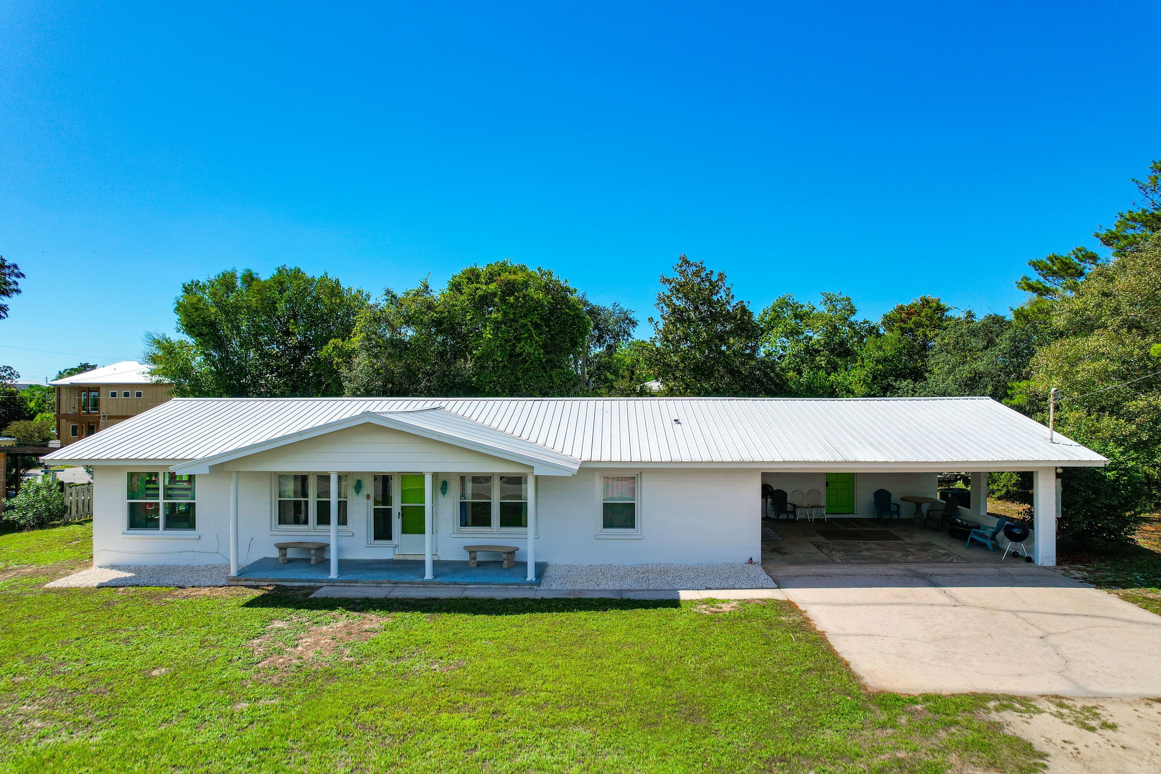 Property Exterior | Covered Porch w/ Seating | Private Yard