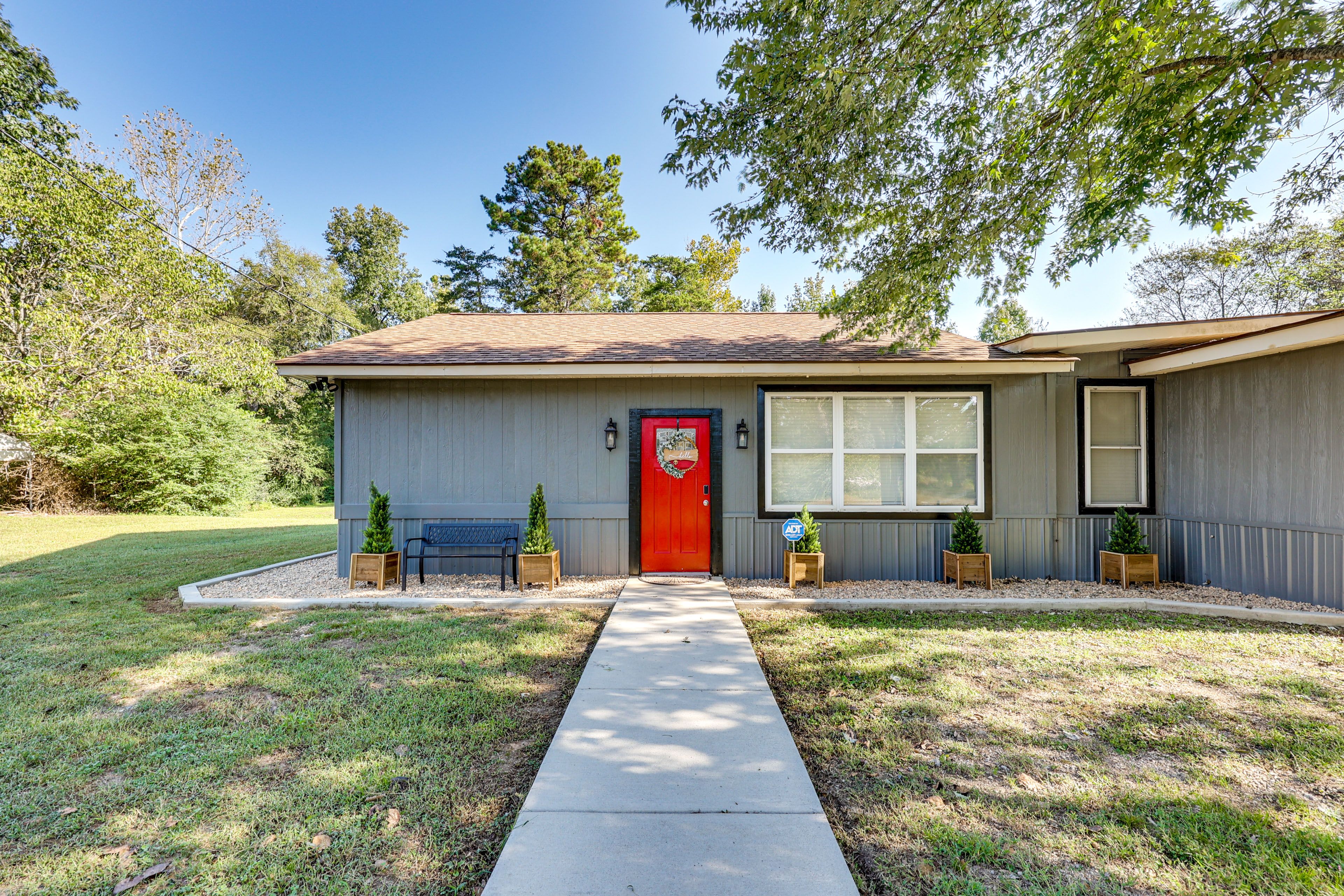 Property Exterior | 2 Grills | Fire Pit | Spacious Yard w/ Games