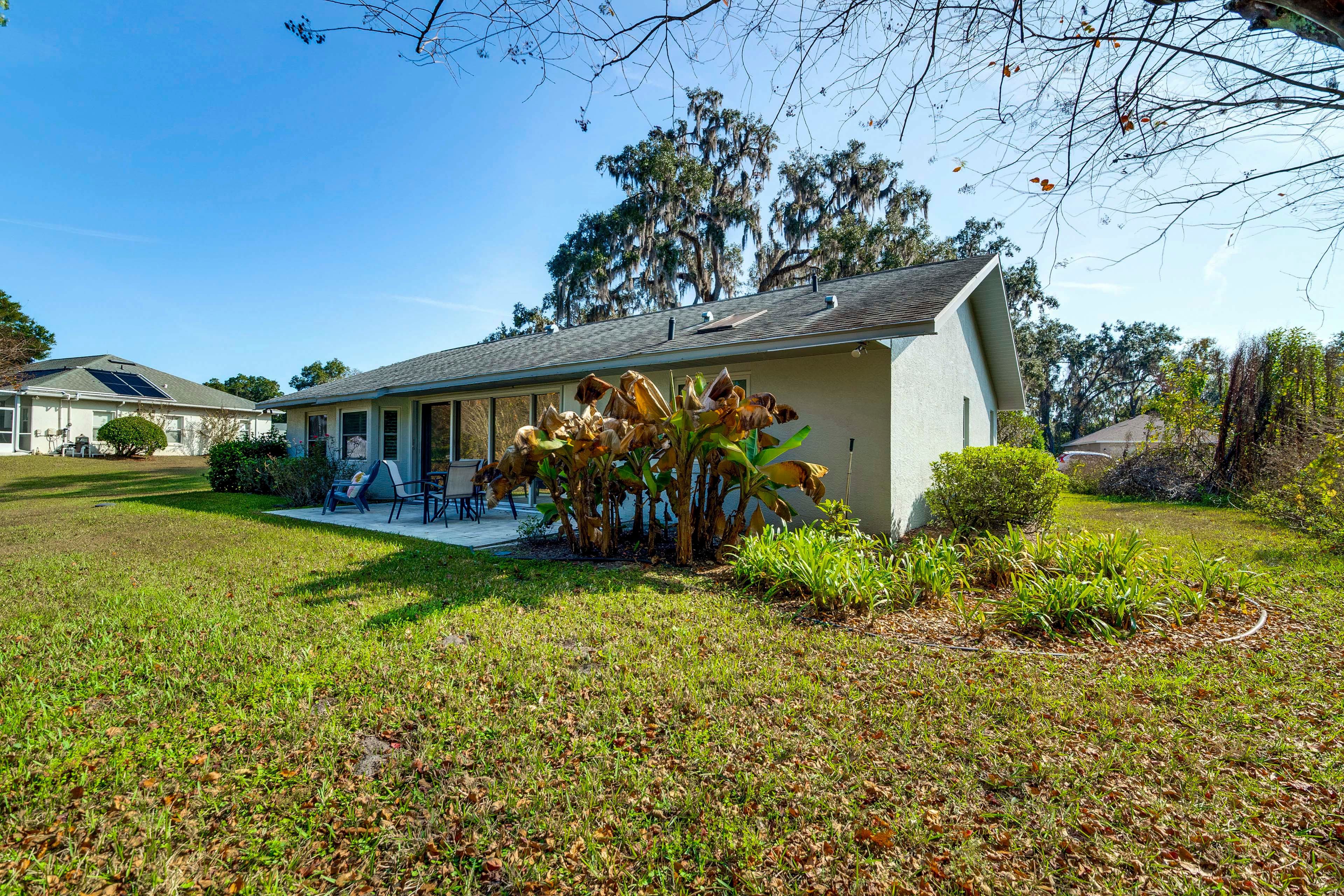 Property Exterior | Single-Story Home | Spacious Yard | Furnished Patio