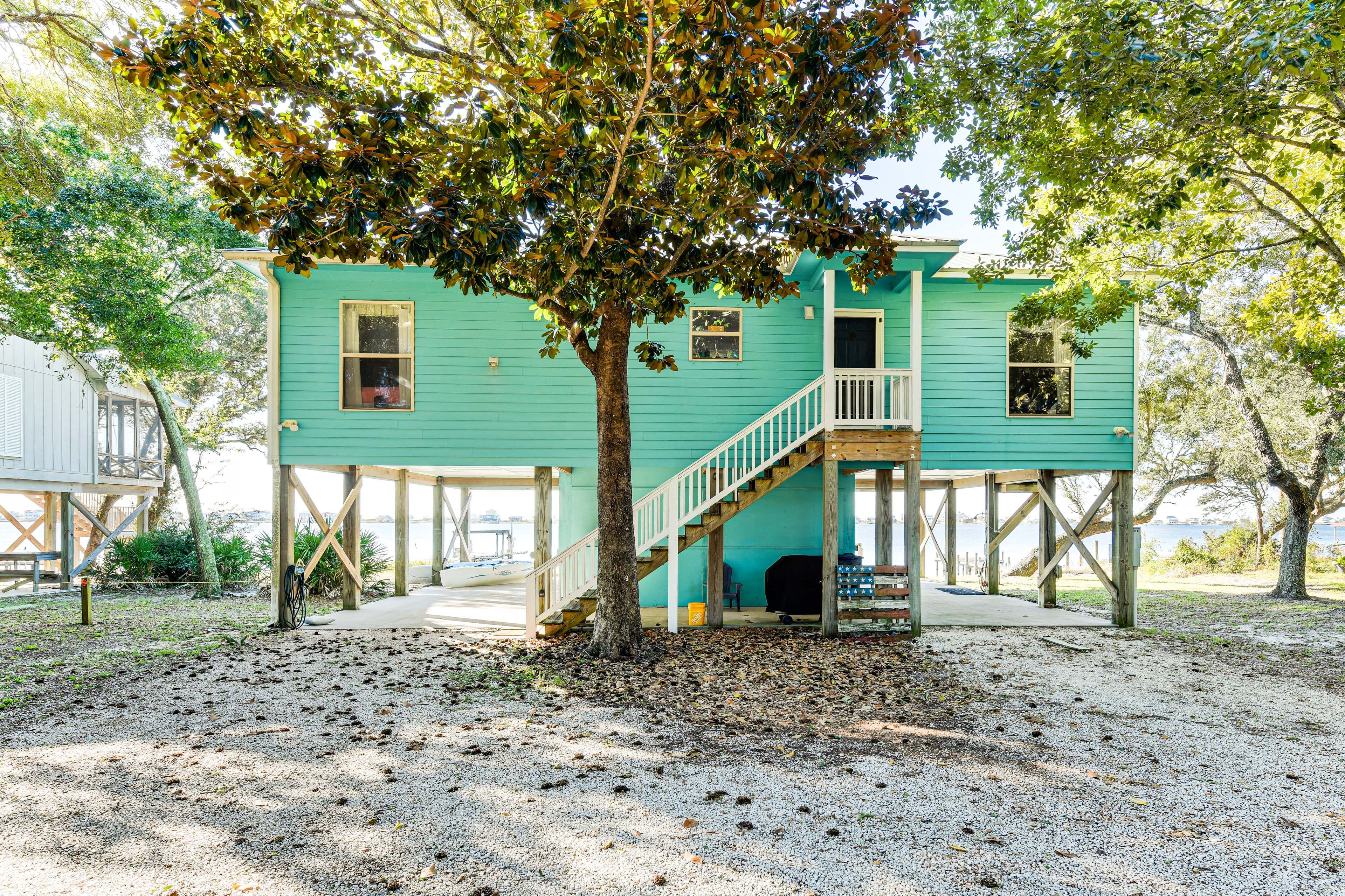 Property Exterior | Covered Patio w/ Seating | Private Dock