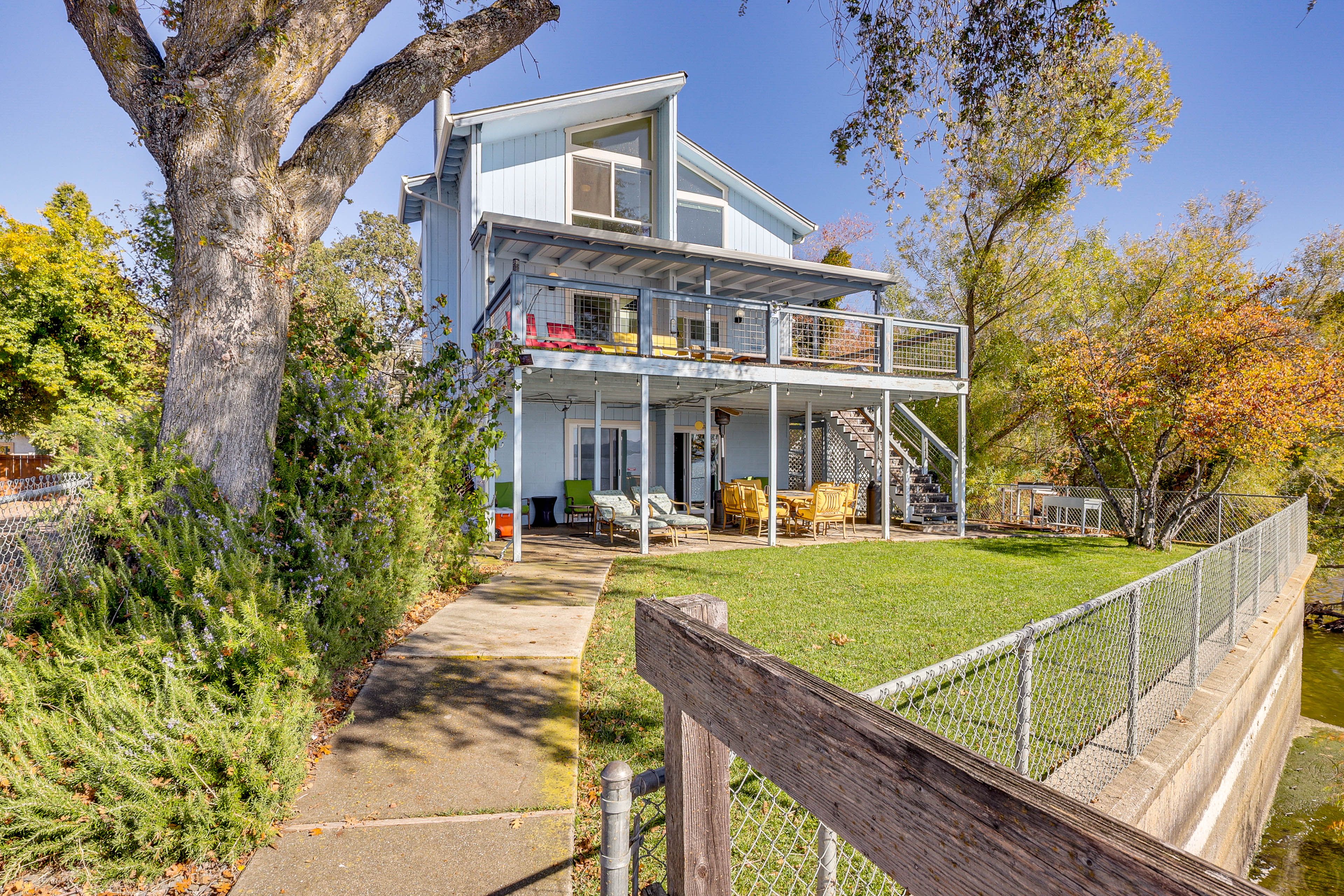 House Exterior | Fenced Backyard | Patio w/ Dining Areas | Furnished Deck