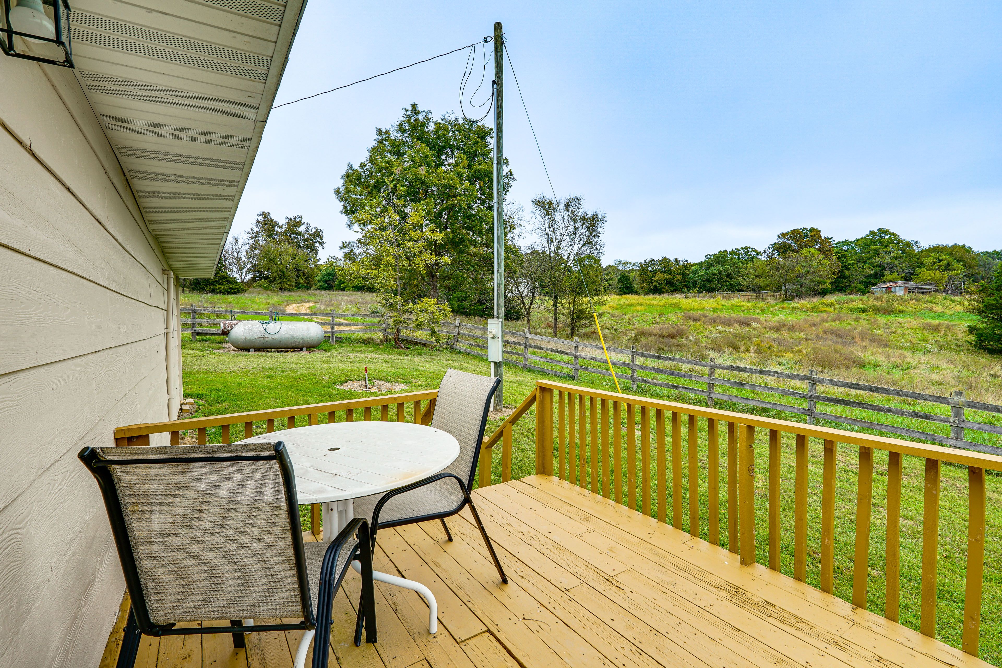 Cabin Exterior | Deck w/ Dining Area | Fenced Yard