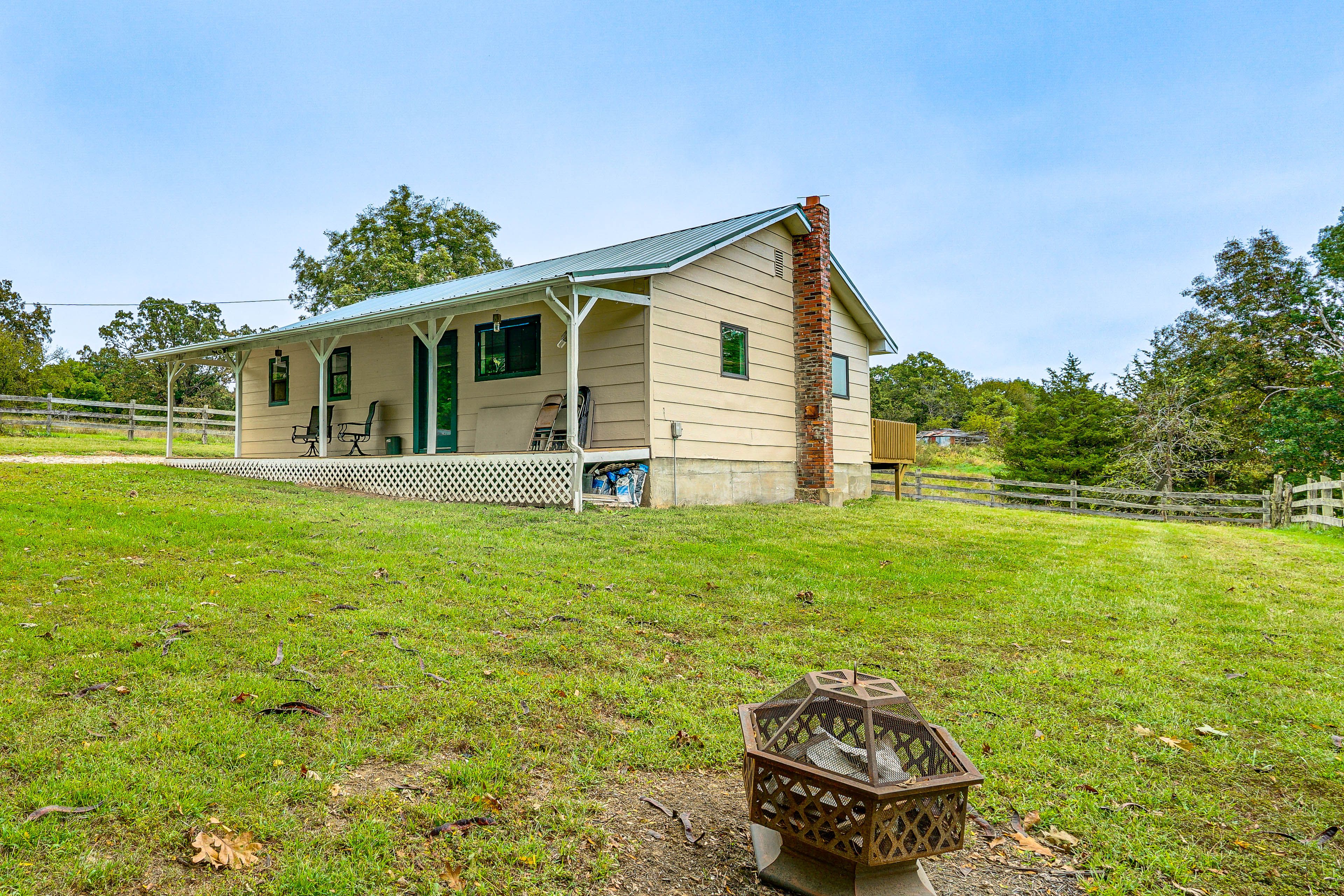 Cabin Exterior | Wood-Burning Fire Pit | Fenced Yard