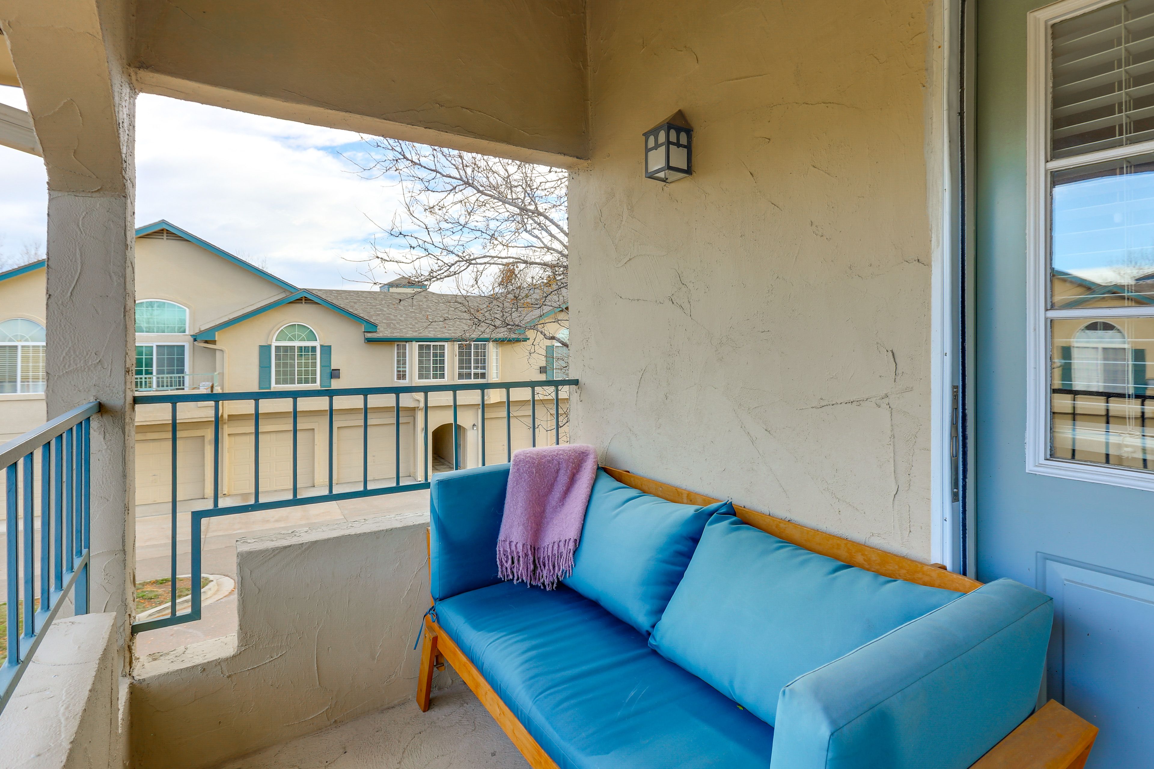 Condo Exterior | Covered Balcony w/ Seating