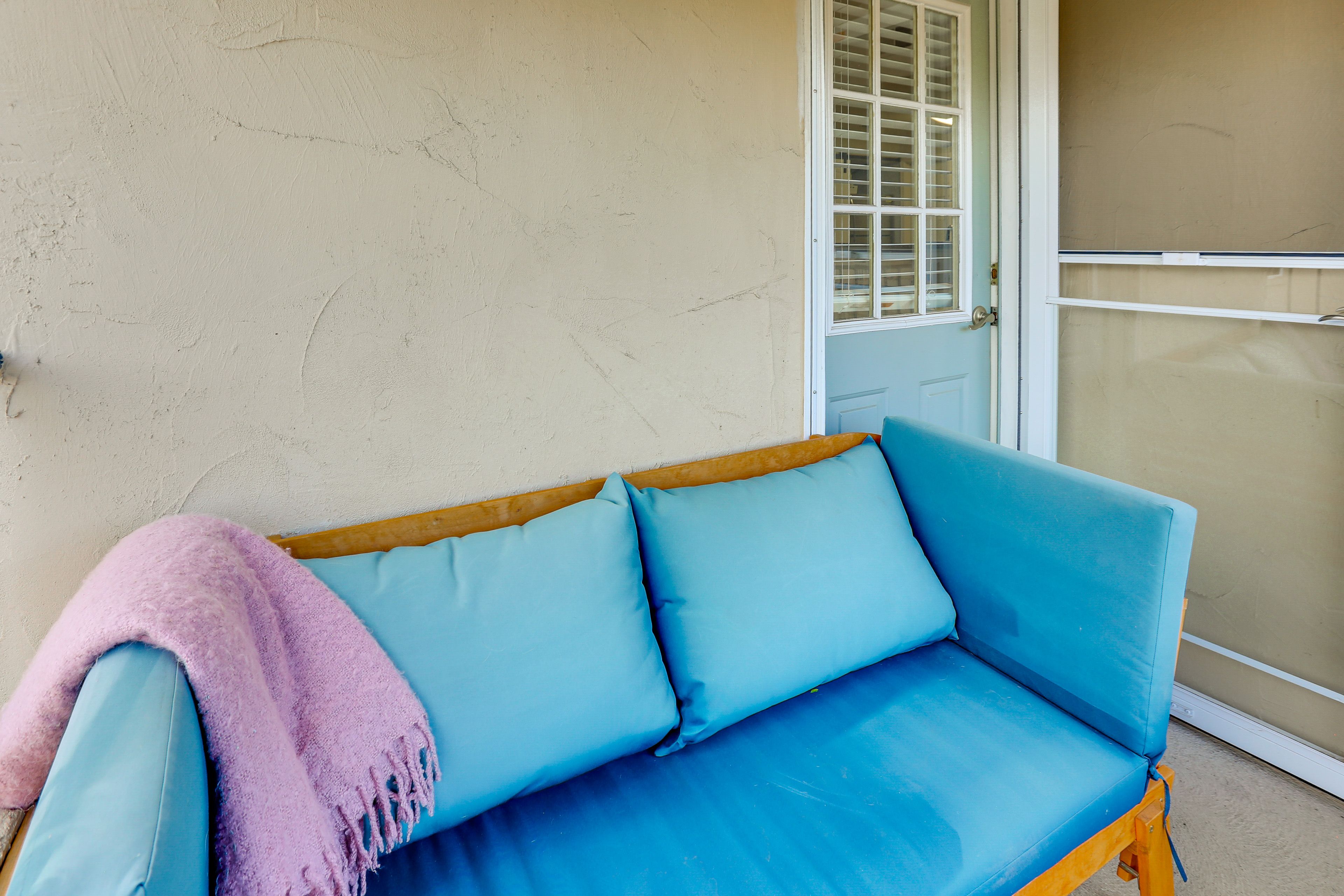 Condo Exterior | Covered Balcony w/ Seating