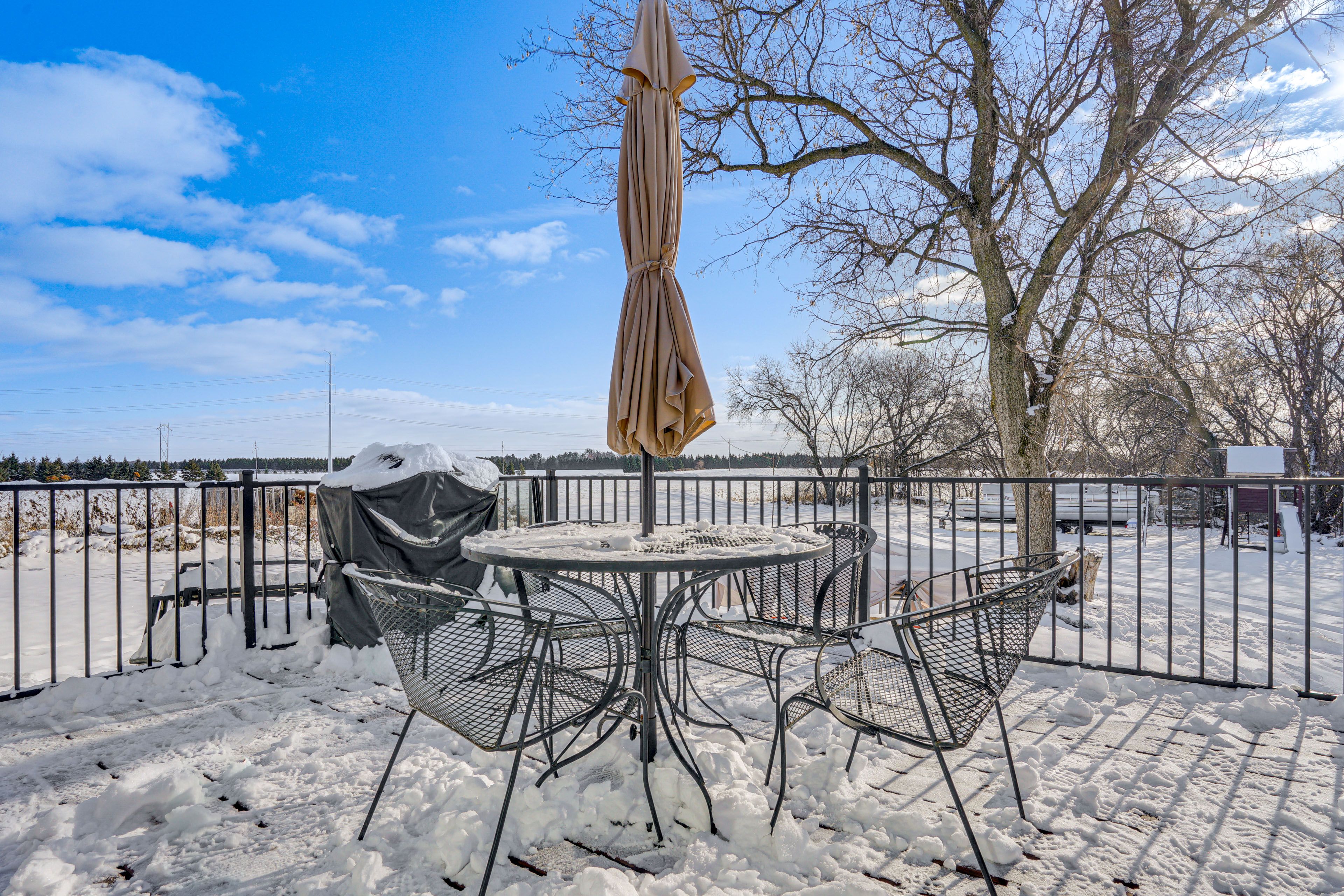 House Exterior | Deck w/ Dining Area & Umbrella | Gas Grill