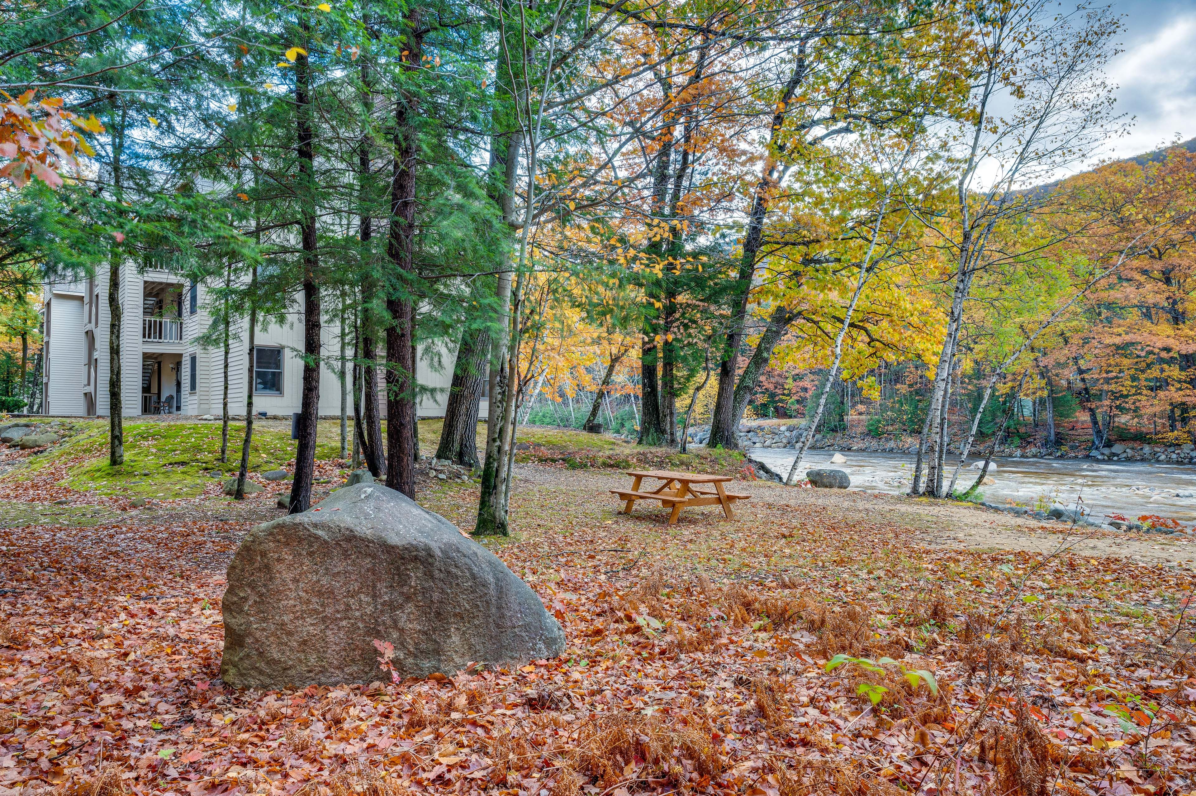 Riverfront Condominiums | Sandy Open Space w/ Picnic Table
