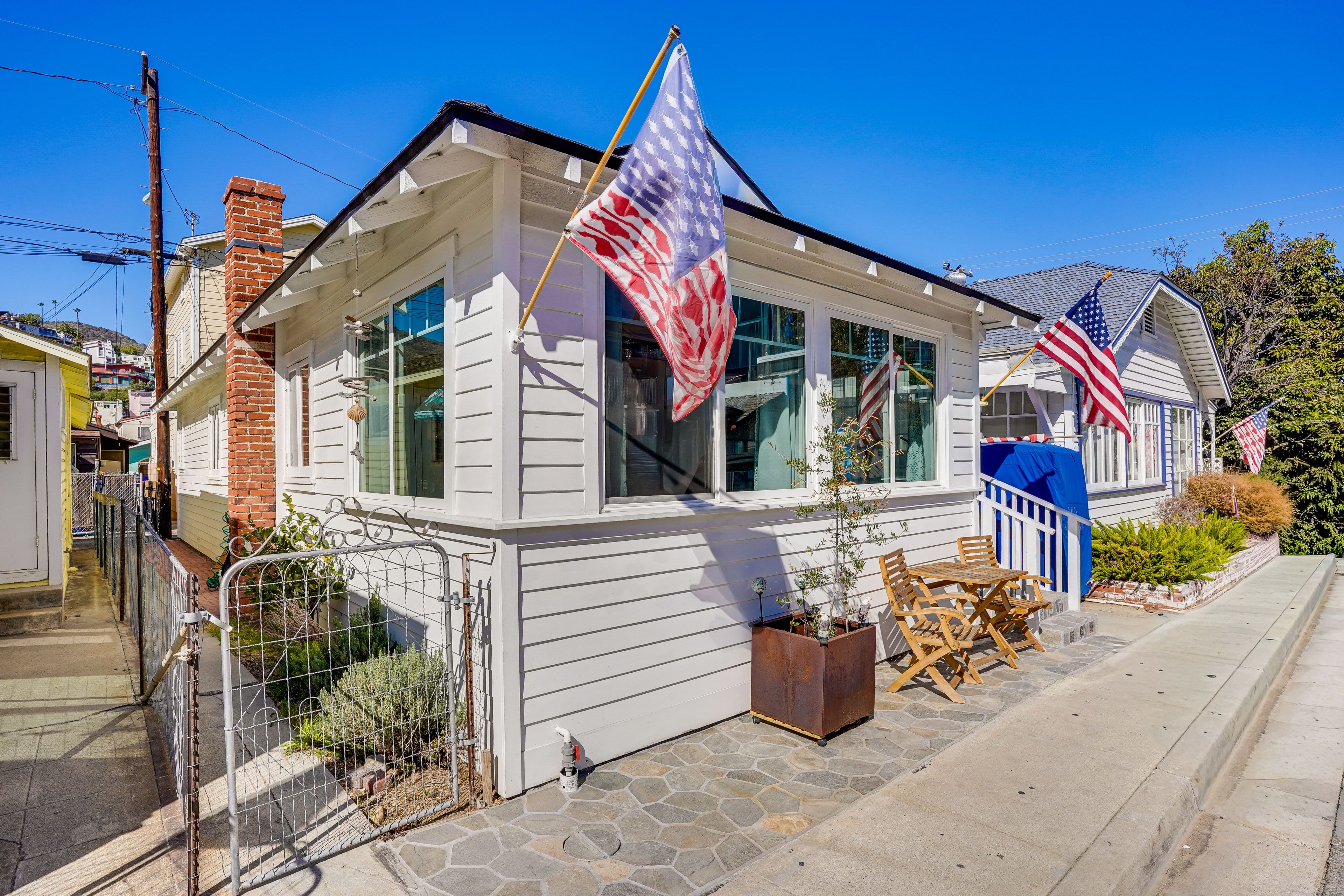 House Exterior | Small Patio w/ Seating | Shower