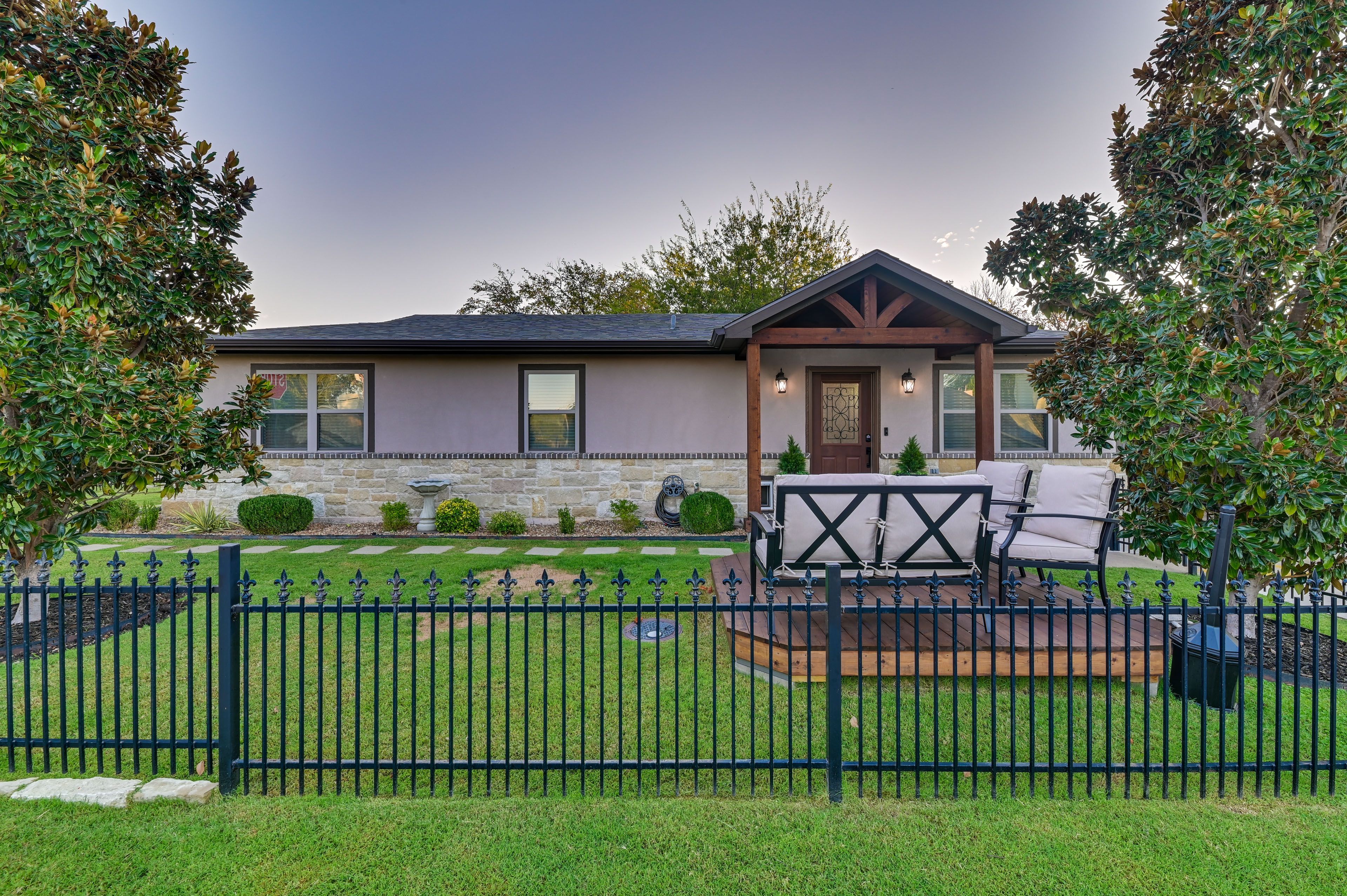 Property Exterior | Single-Story Home | Fenced-In Yard w/ Seating